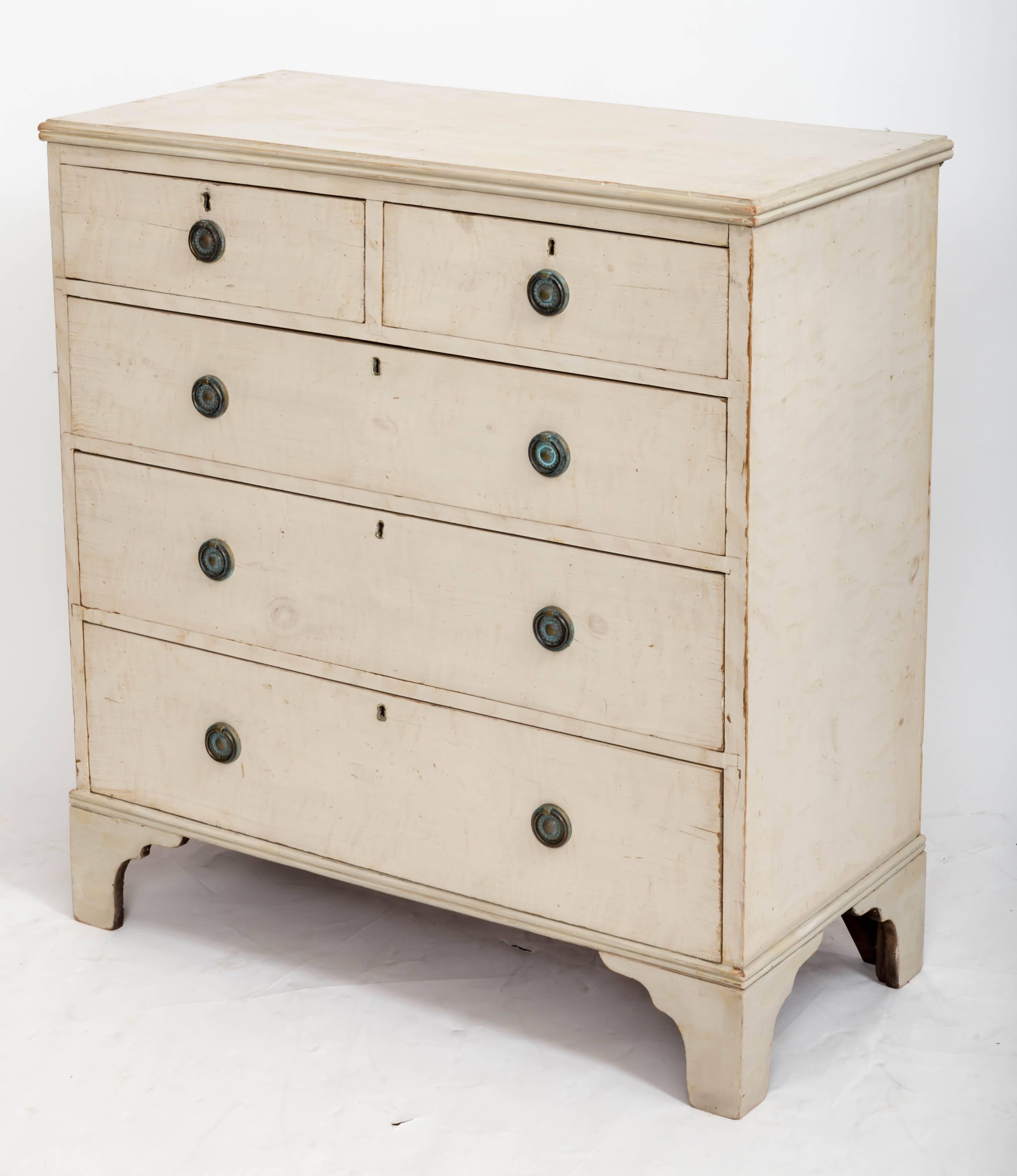 A handsome painted chest of drawers, original crème paint, five drawers ( two short over three long), braded feet, antique pulls.
