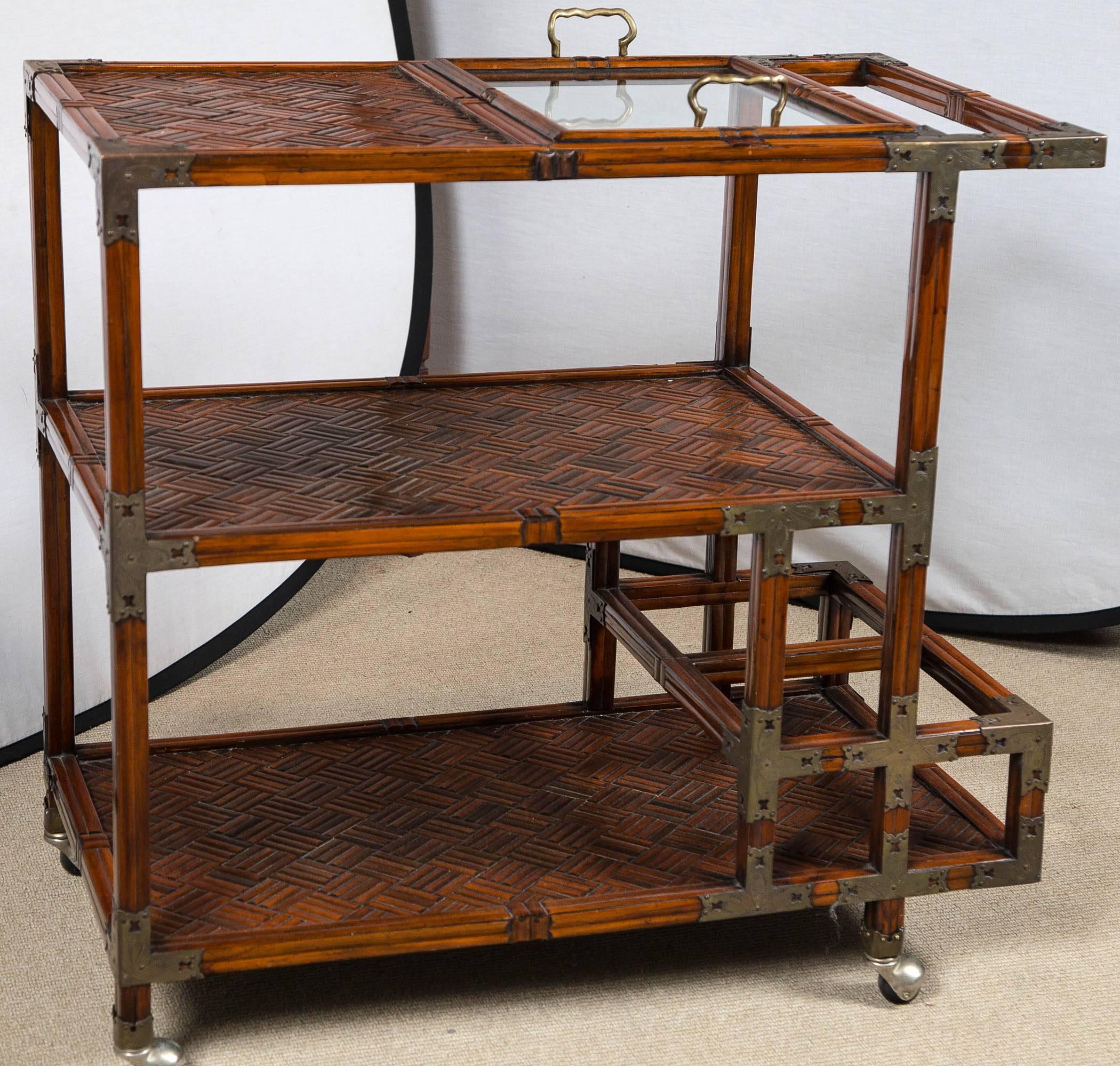 English bamboo bar cart on casters with campaign style brackets, circa 1900.