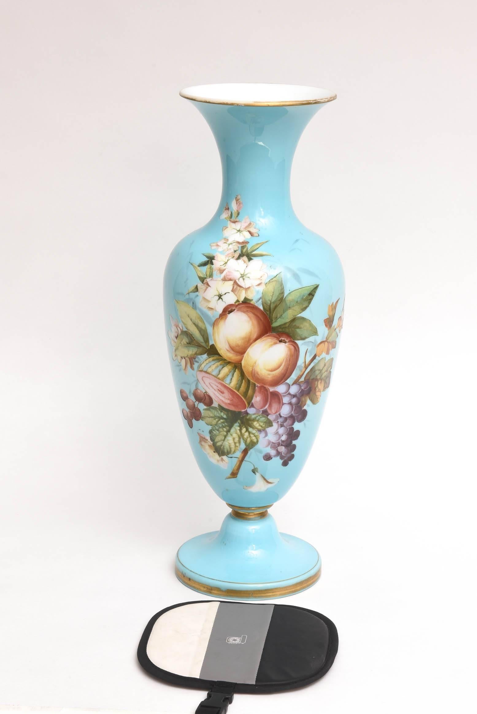 An elegant and tall vase with a pedestal base highlighted with crisp and beautiful florals on its vibrant turquoise ground, 19th century and of the quality and style produced by Baccarat of that era. Lovely antique condition for being over 150 years