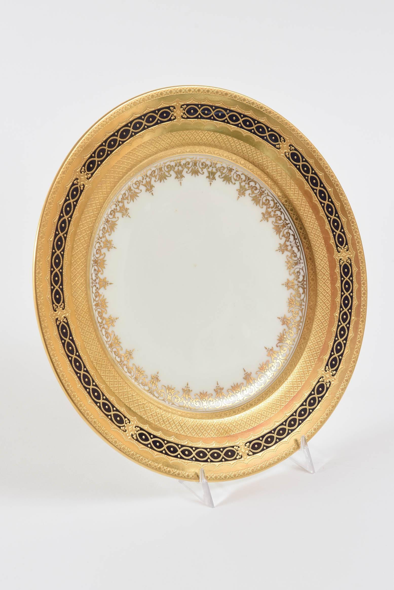 A delightful design on the edge of these elegant dinner plates. Designed and crafted by Coalport one of our favorite Gilded Age factories. Raised tooled gilt bracelet design on a rich cobalt blue. Custom ordered through the fine retailer of Marshall
