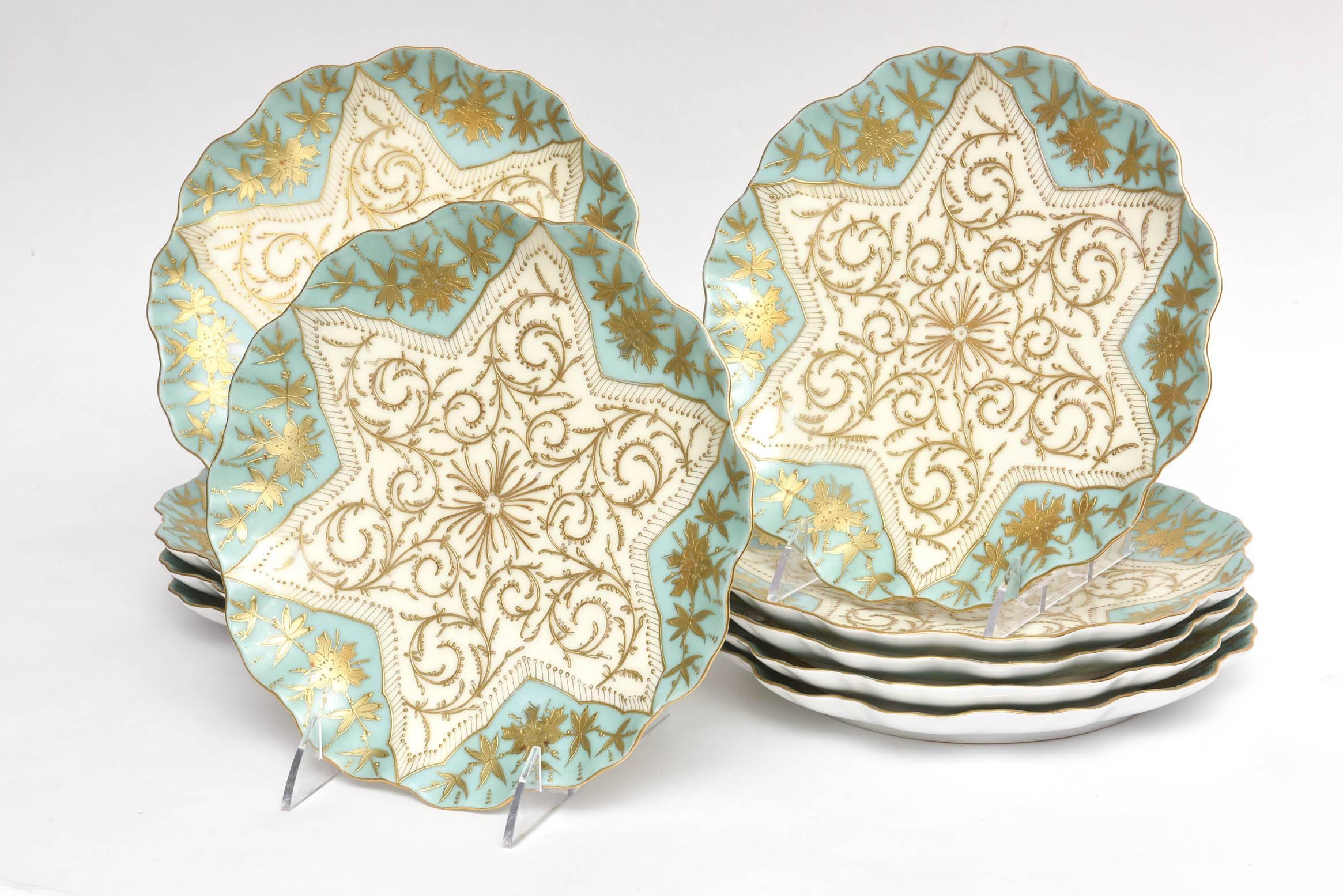 A beautiful shade of soft aqua or sea foam, these plates were custom ordered through the fine gilded age retailer of Ovington Brothers New York. All-over decorated with raised paste gilding and featuring a pretty shade of turquoise. Fine bone
