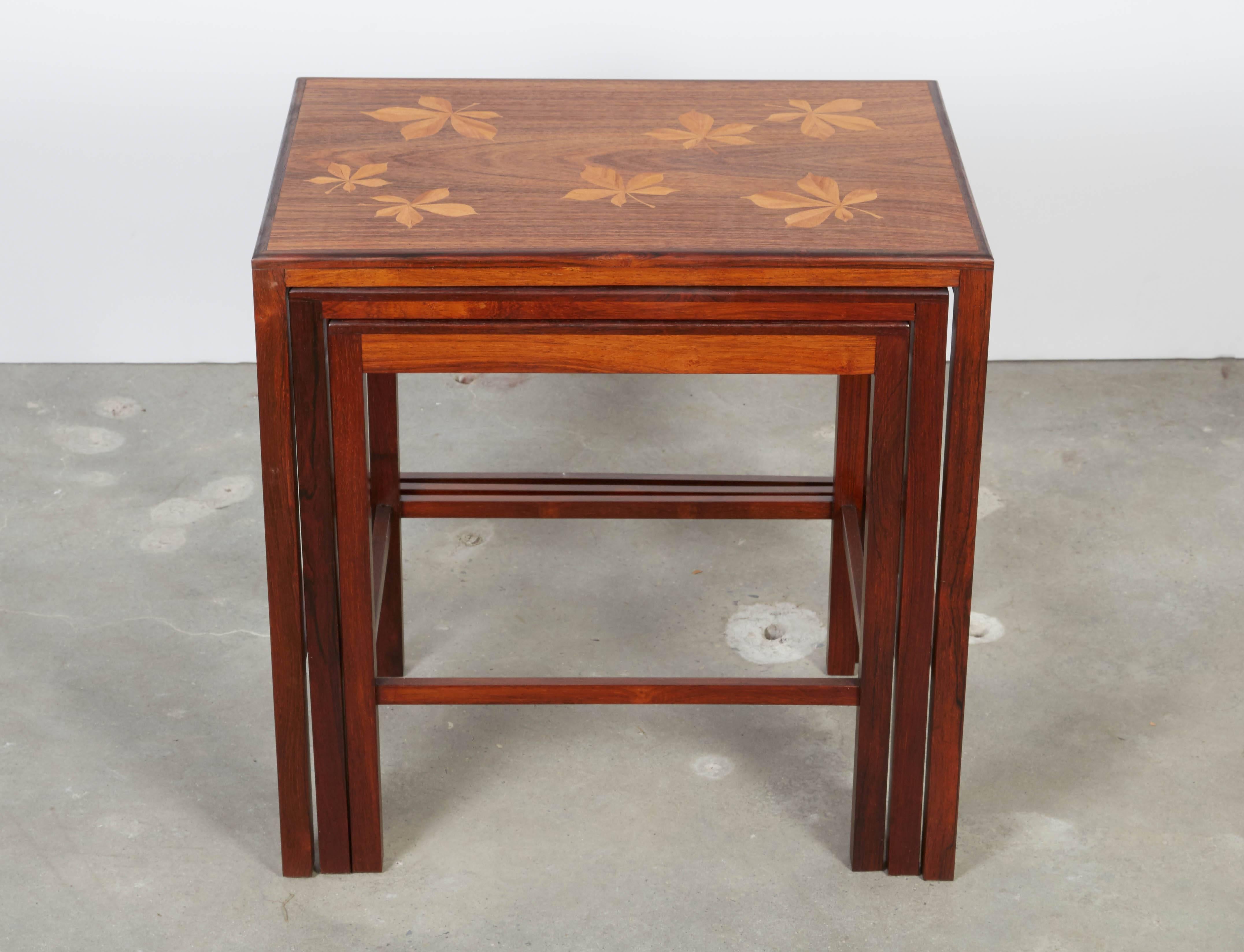 Vintage 1960s Mid Century Rosewood Nesting Tables with Leaf Chestnut Inlay

This set of Modern nesting tables are excellent condition and have that amazing inlay. Great as bedroom nightstands or living room side tables. These are very special. Hard