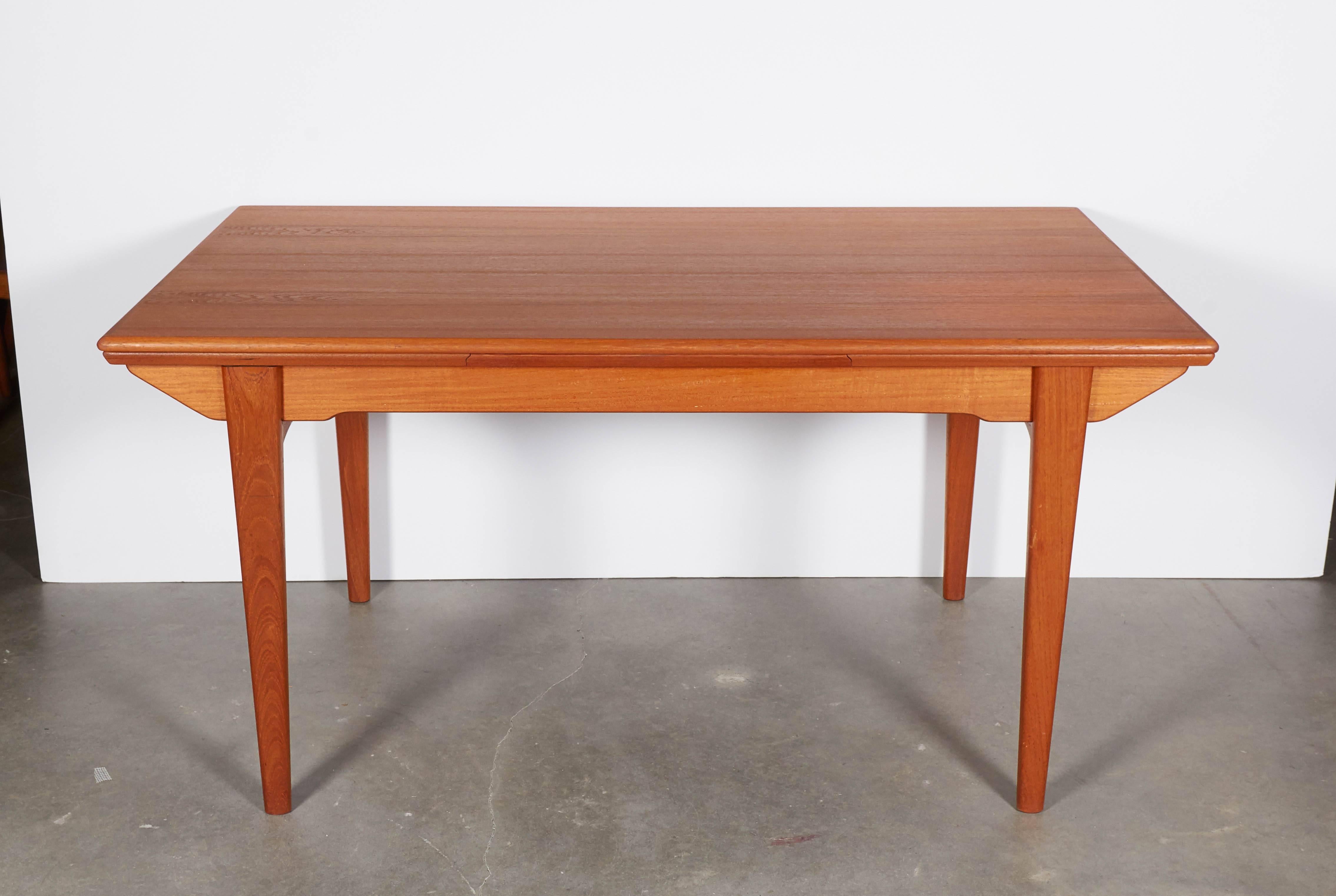 Vintage 1960s Danish Teak Dining Table with 2 Leaves

This dining table is in excellent condition and is also expandable. The leaves are 19.25" each and pull out from either side. Ready for pick up, delivery, or shipping anywhere in the world. 