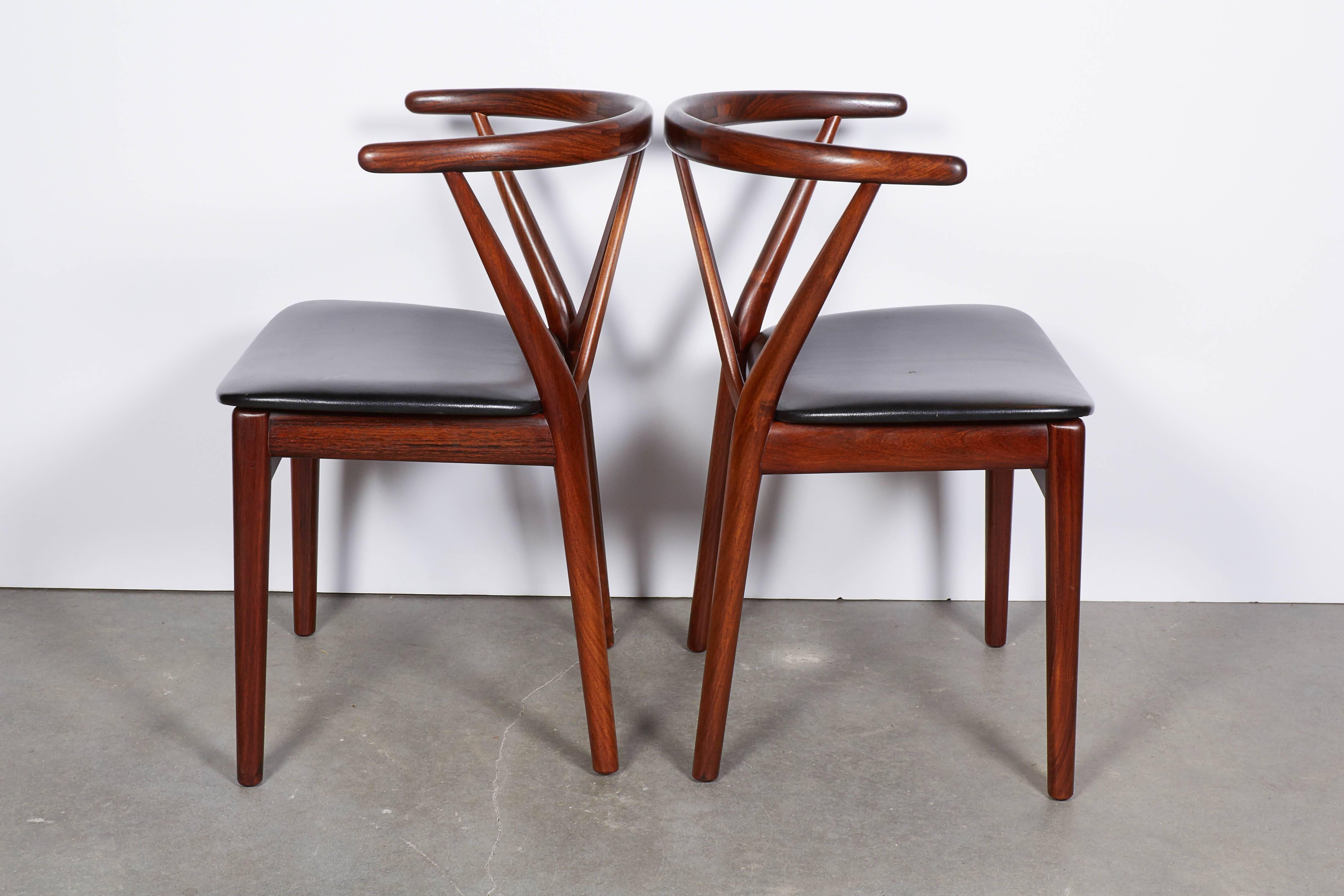 Vintage 1960s Rosewood Dining Chairs, set of 4

This set of 4 Danish dining chairs are in excellent condition. The arms offer great support and can also be used as extra occasional chairs. Ready for pick up, delivery, or shipping anywhere in the