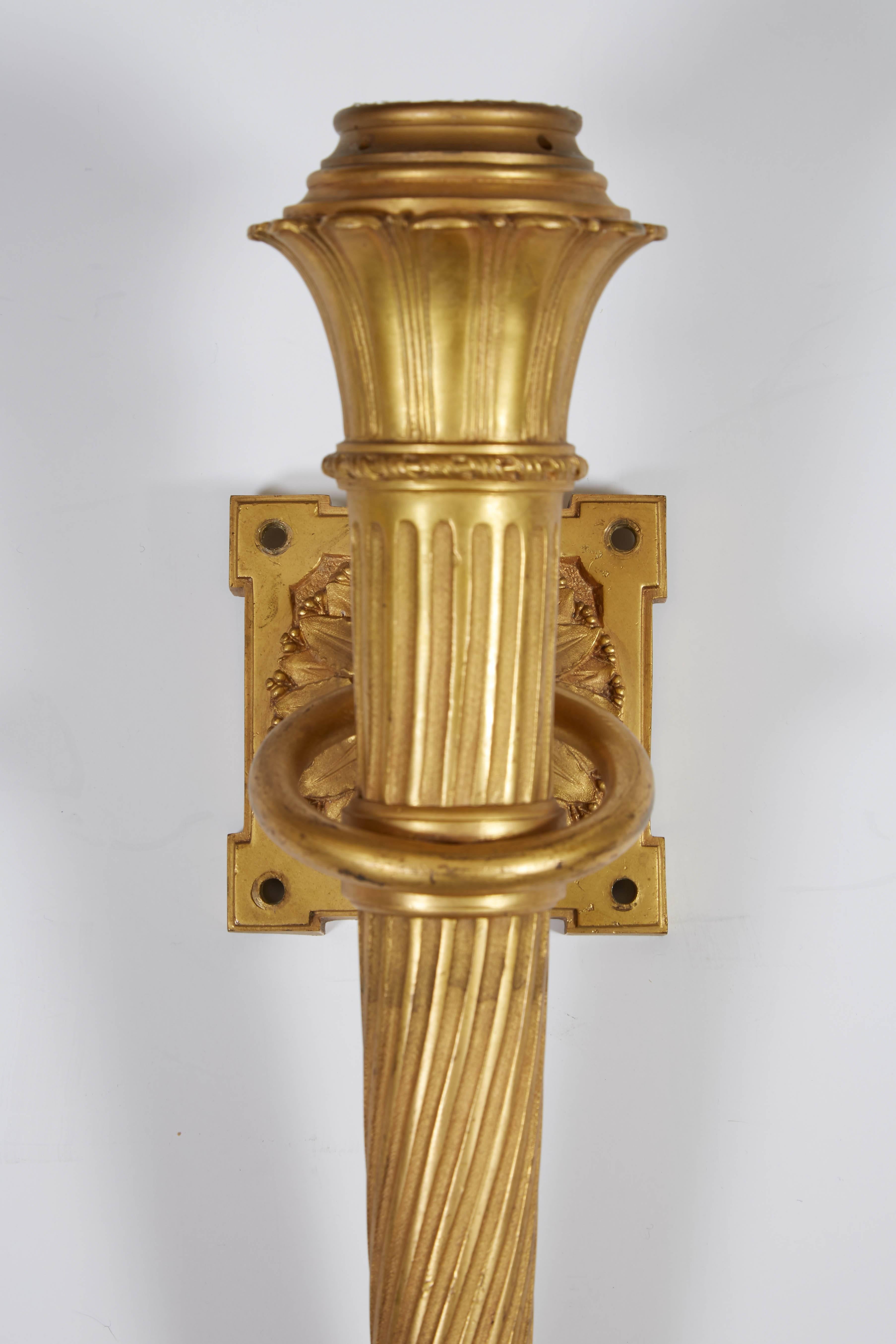 Set of Four Neoclassical Style Gilt Bronze Torch Form Wall Lights In Good Condition In New York, NY