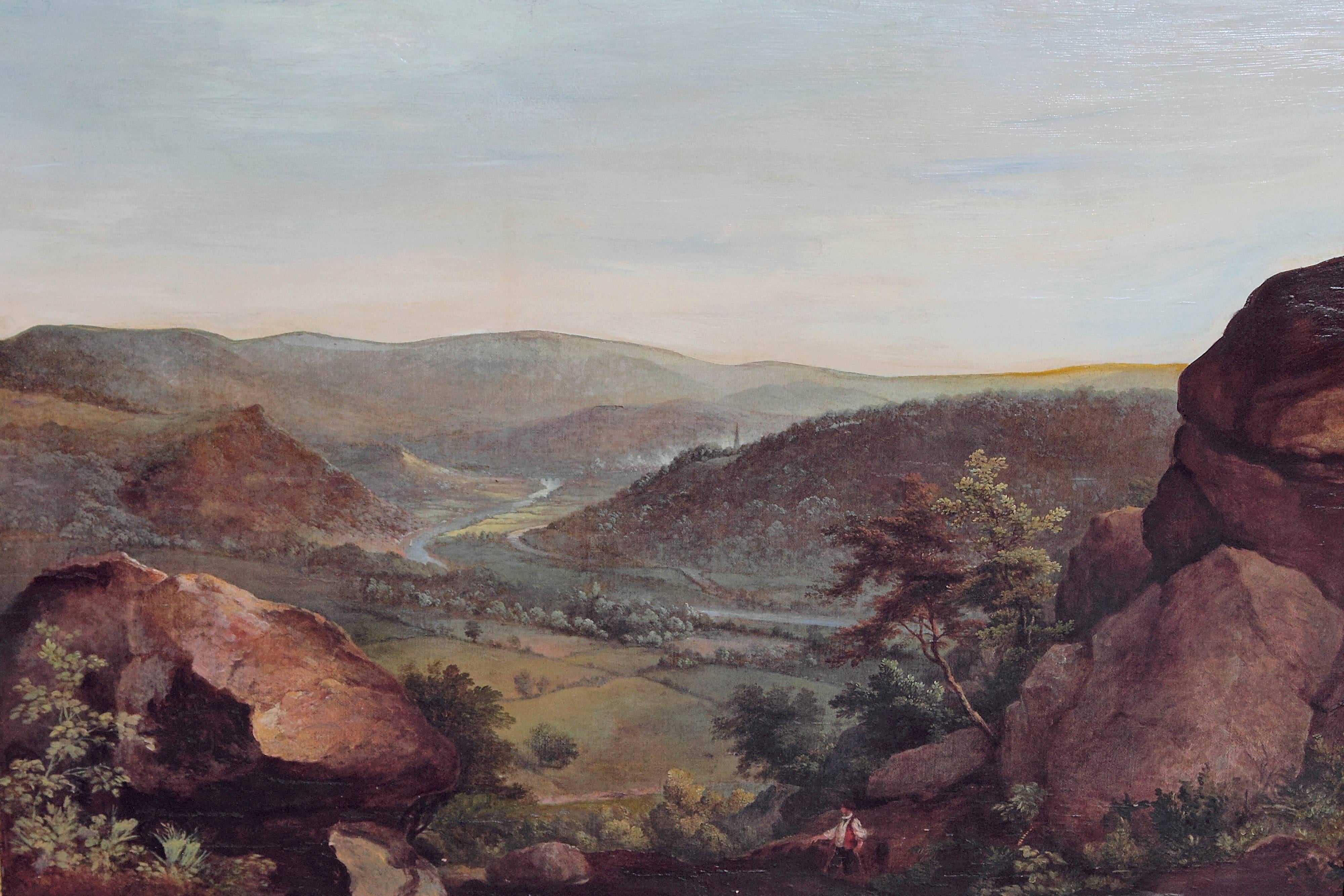 A large landscape painting of Monmouth Wales, with a man in the foreground going toward the mountains and the valley below. Well painted and atmospheric with period frame. By William Gill, English 1826-1871. Hand written label in verso reads, 