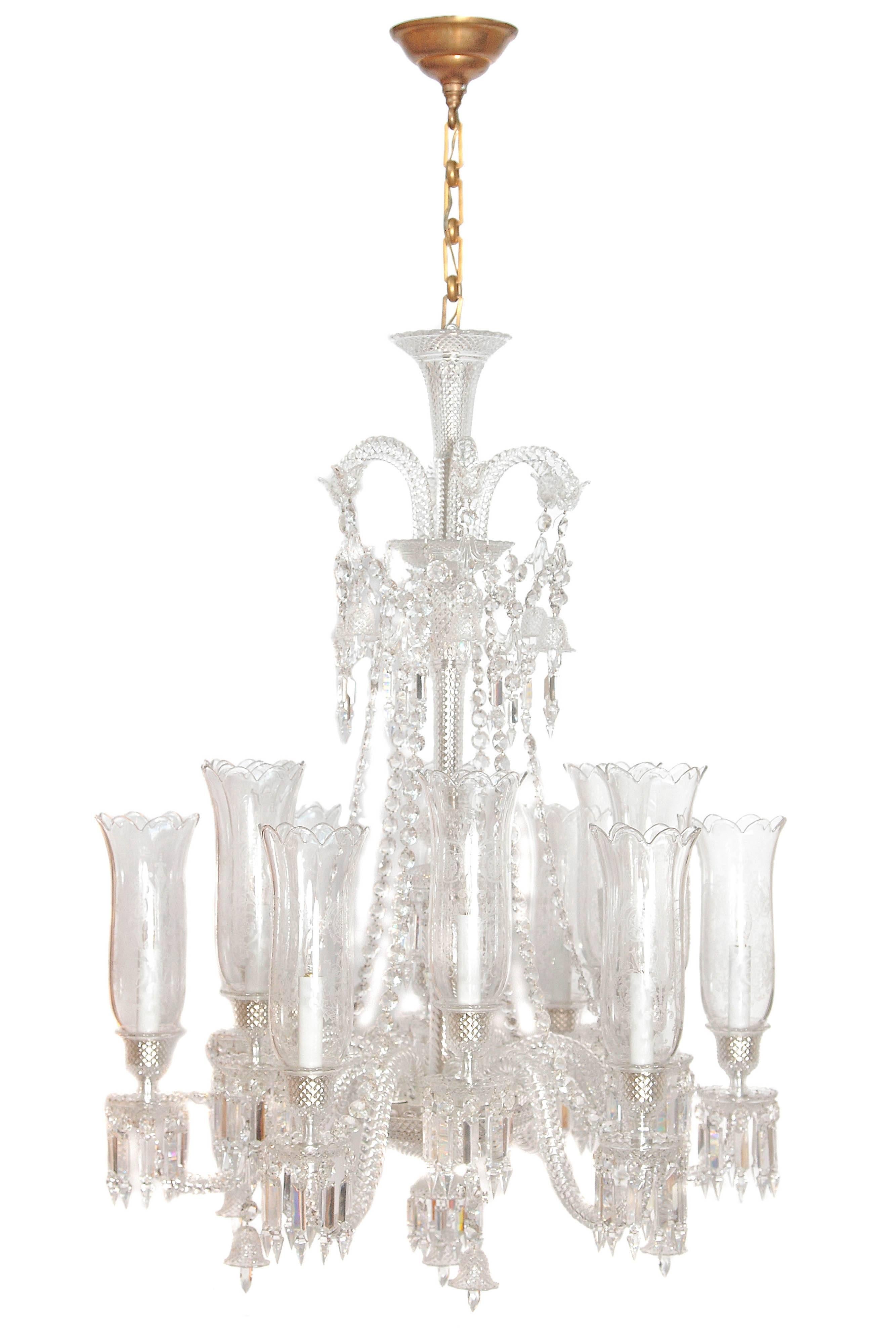 From Baccarat's Zenith collection by French designer Philippe Starck, the Zenith long twelve-light chandelier (the iconic Baccarat chandelier par excellence), handcrafted full-lead crystal made in France, the fixture has a central column of cut