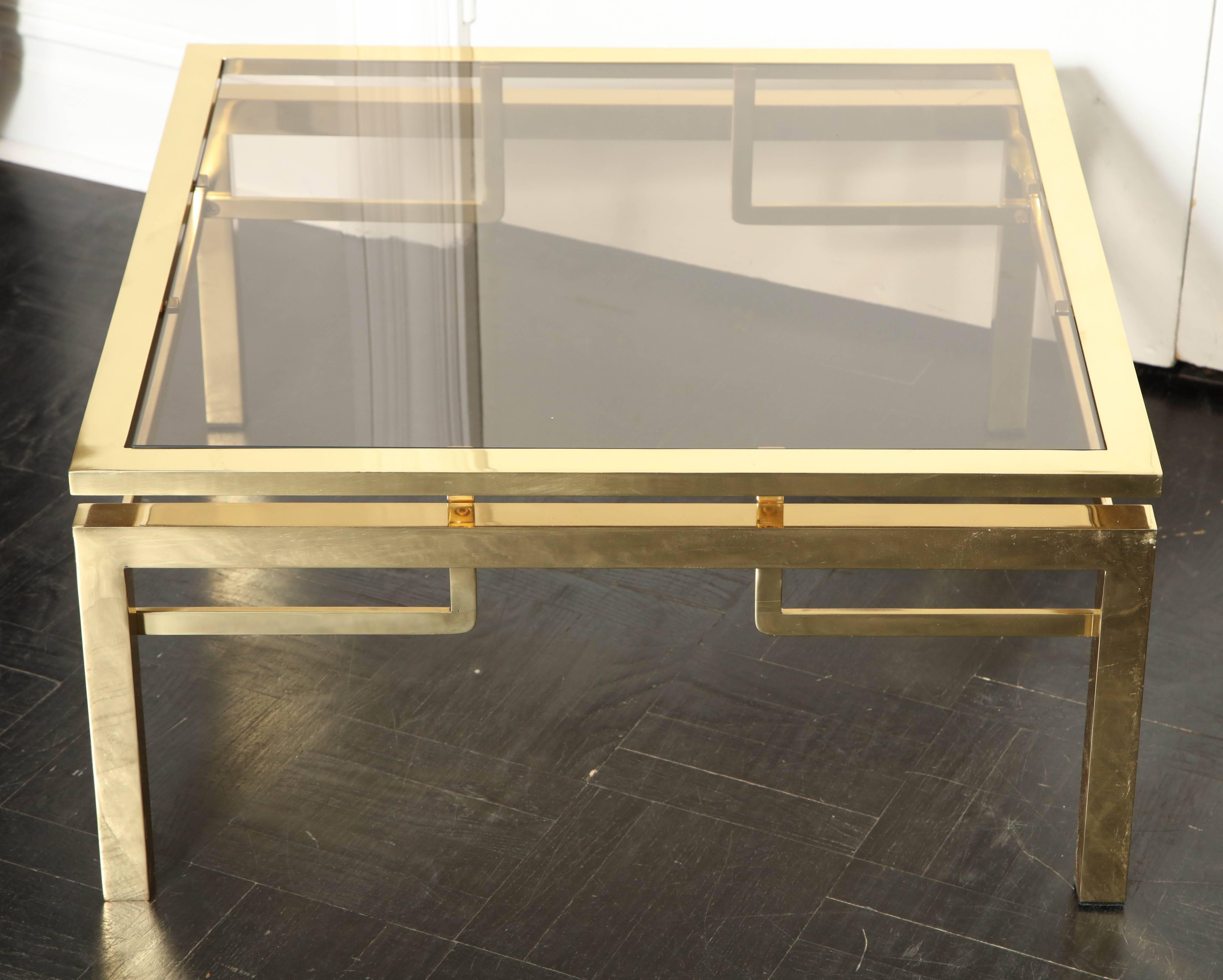 20th century smoked glass and brass cocktail table.