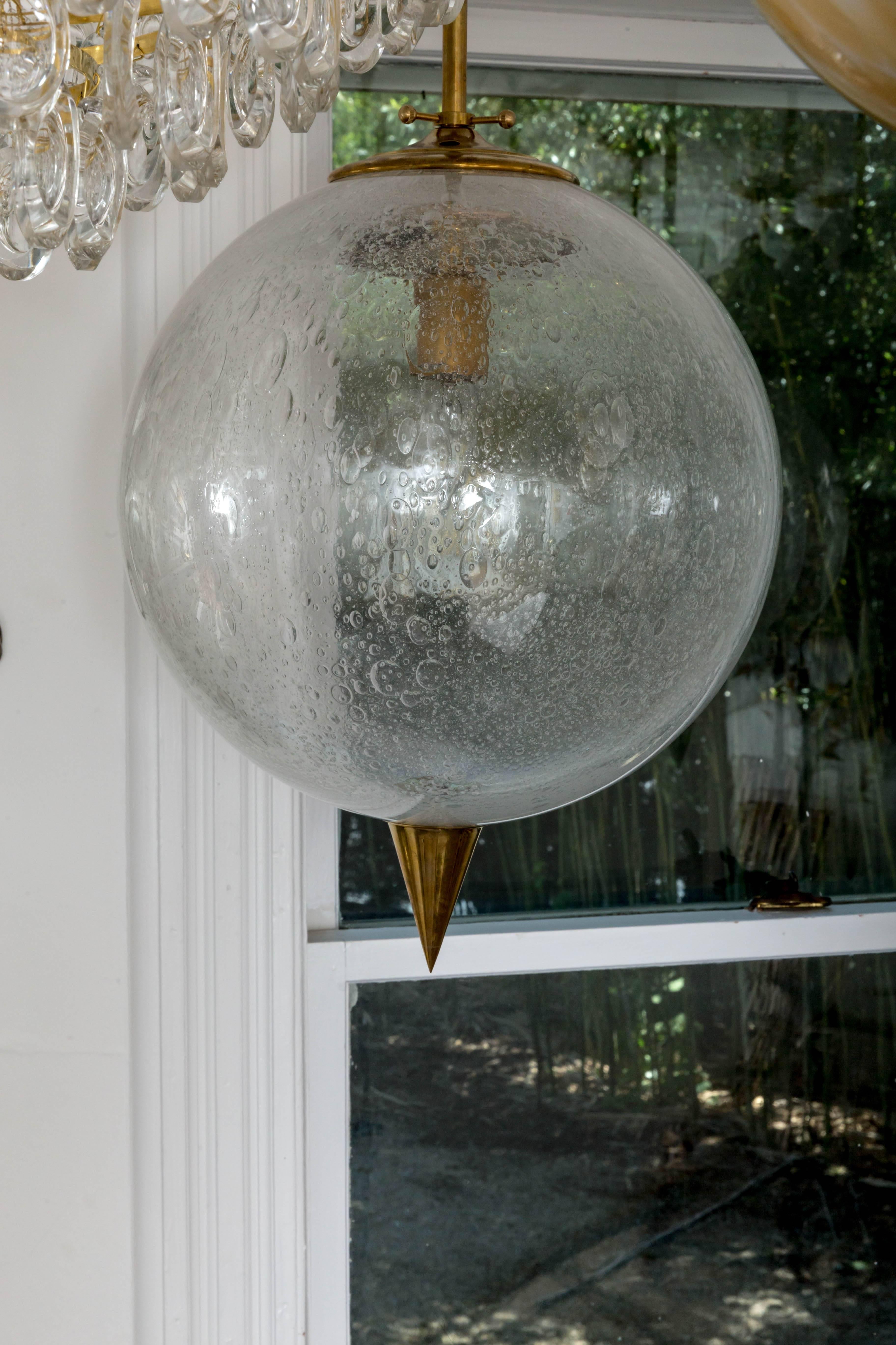 Spherical Clear Glass Pendant with Inclusive Air Bubbles and Brass Details In Excellent Condition For Sale In Bridgehampton, NY