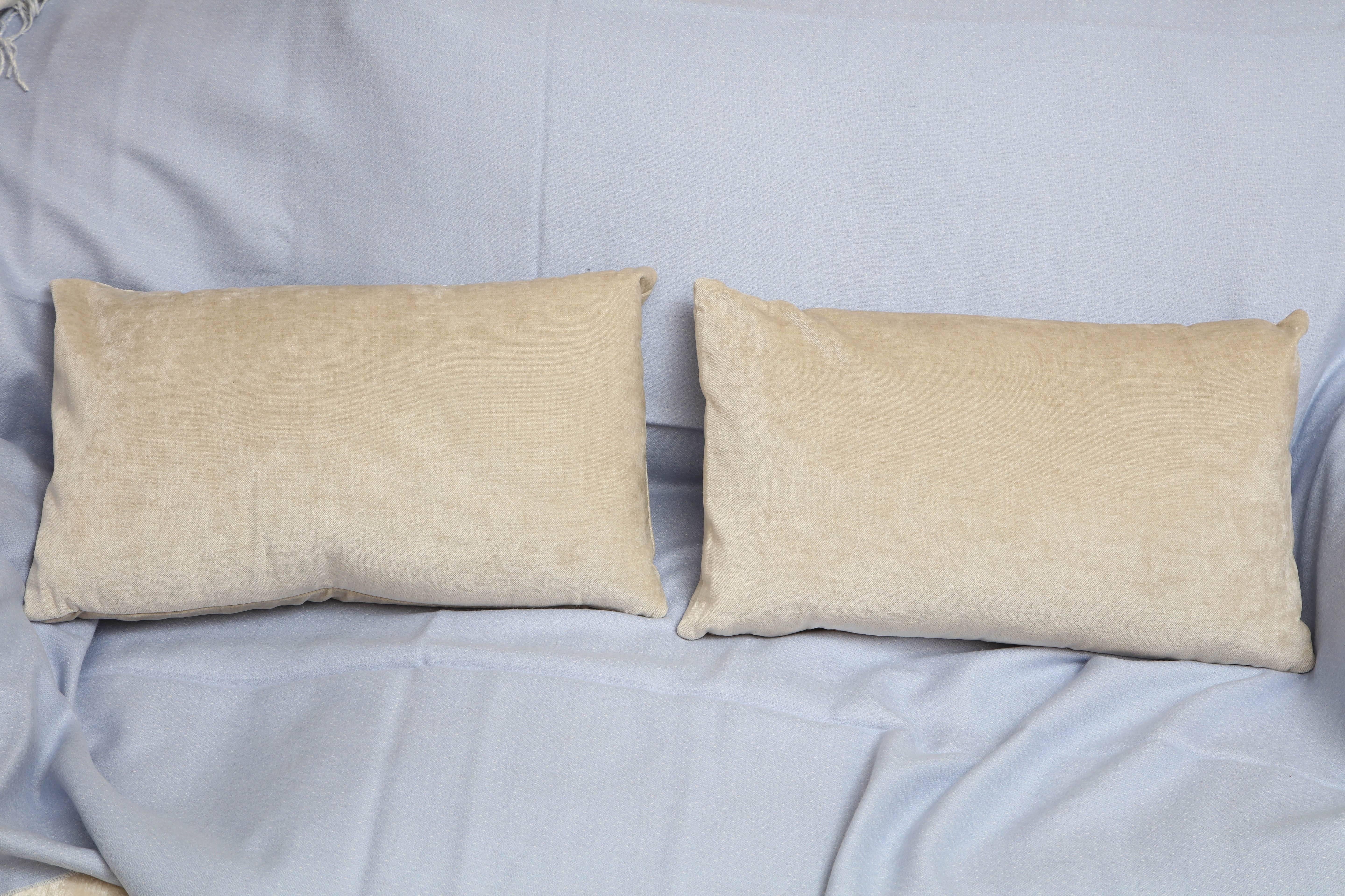 These beige velvet pillows are one of a kind. The beige velvet material is rooted in modern Scandinavian style. It's simple yet elegant design is typical of Scandinavian values. This pair of custom-made pillows are designed by Arlene Angard and with