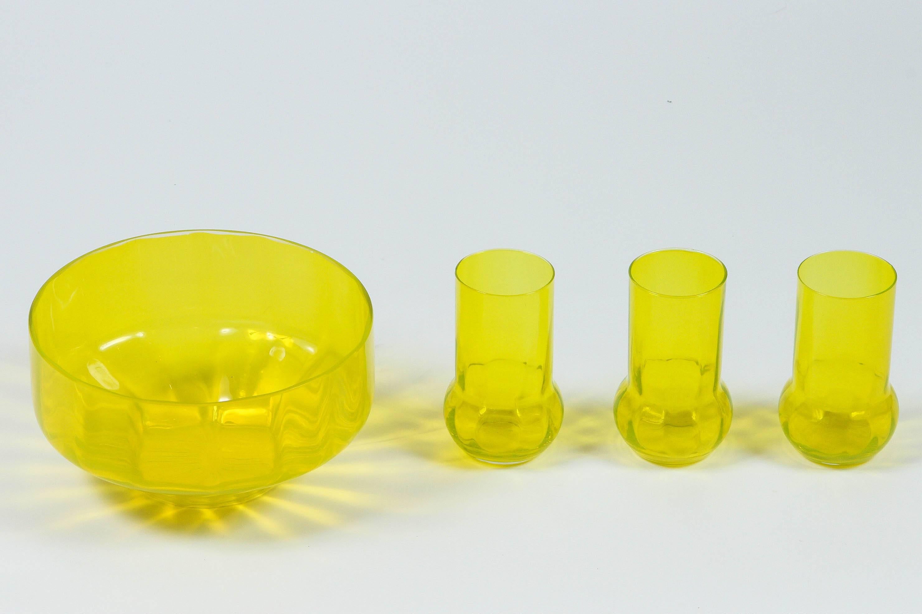 Vaseline Glass Party Set which included a chip bowl, two dip bowls, and six tall tumblers.

Measurements: Cup: 3.25 D x 5.25 H
Small dish: 5.25 D X 2.5 H
Large bowl: 9.25 D X 5 H.

  