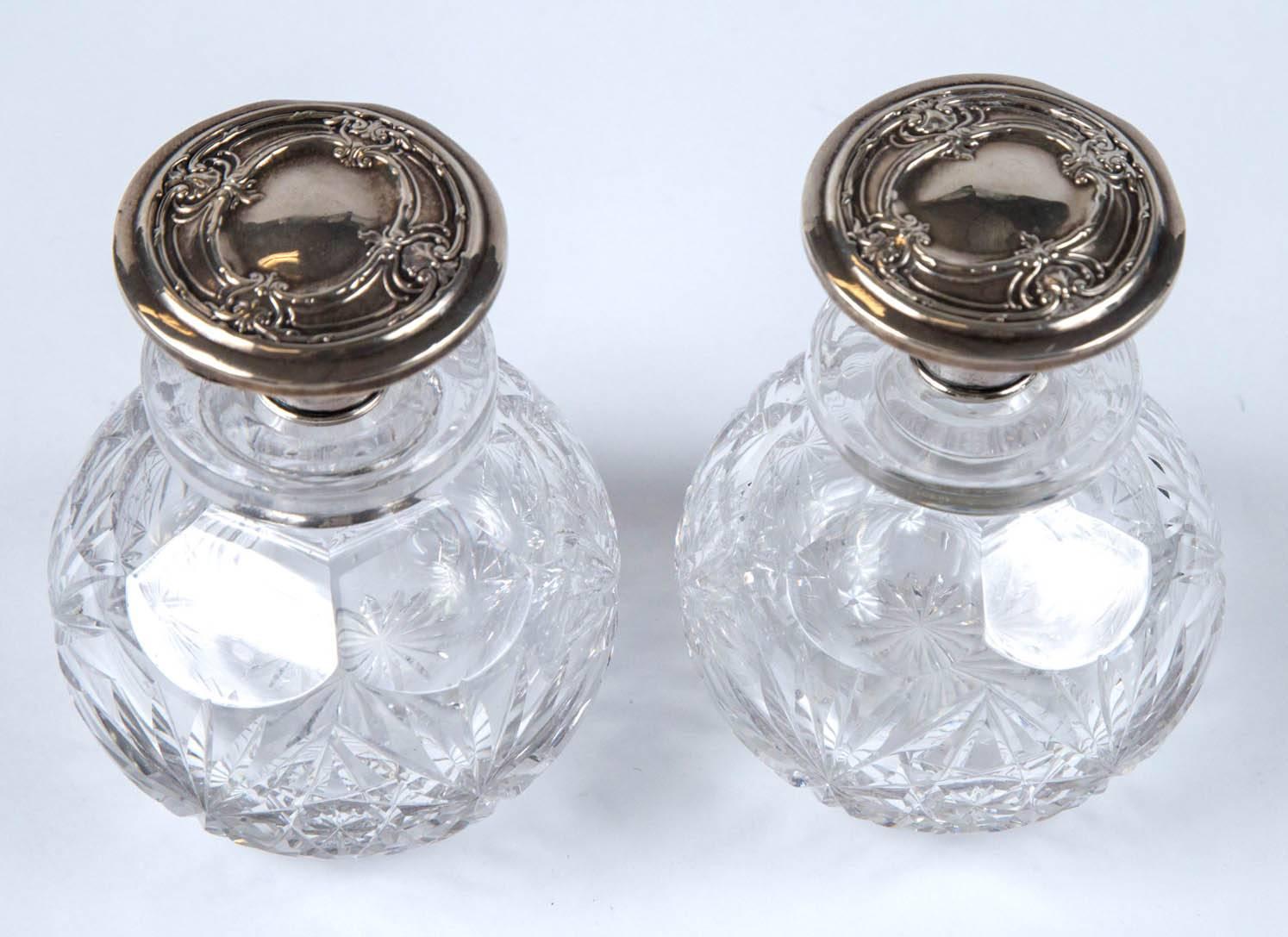 silver topped perfume bottles