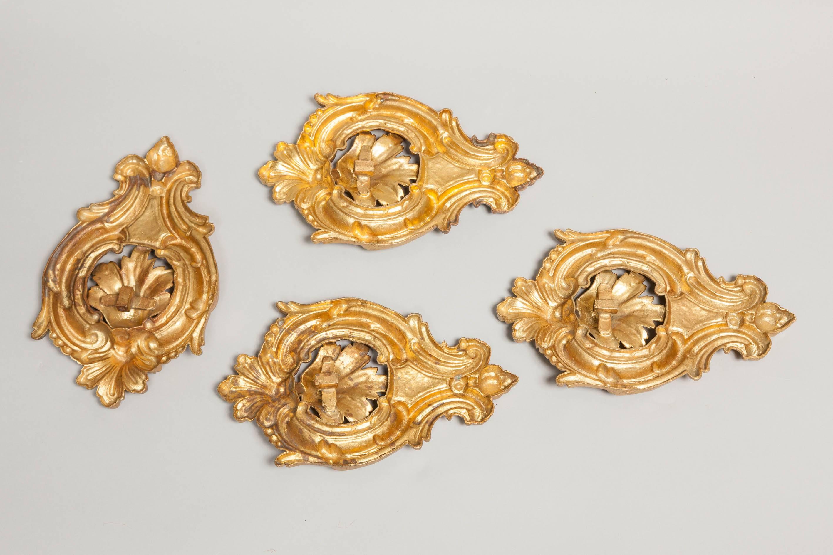 Fabulous and rare set of four heavy cast bronze and gilded (ormolu) curtains hold back brackets, Italian, circa 1830.
Finely carved and chiseled, retaining the original gilding with a warm and mellow patina. Must have for every 19th century