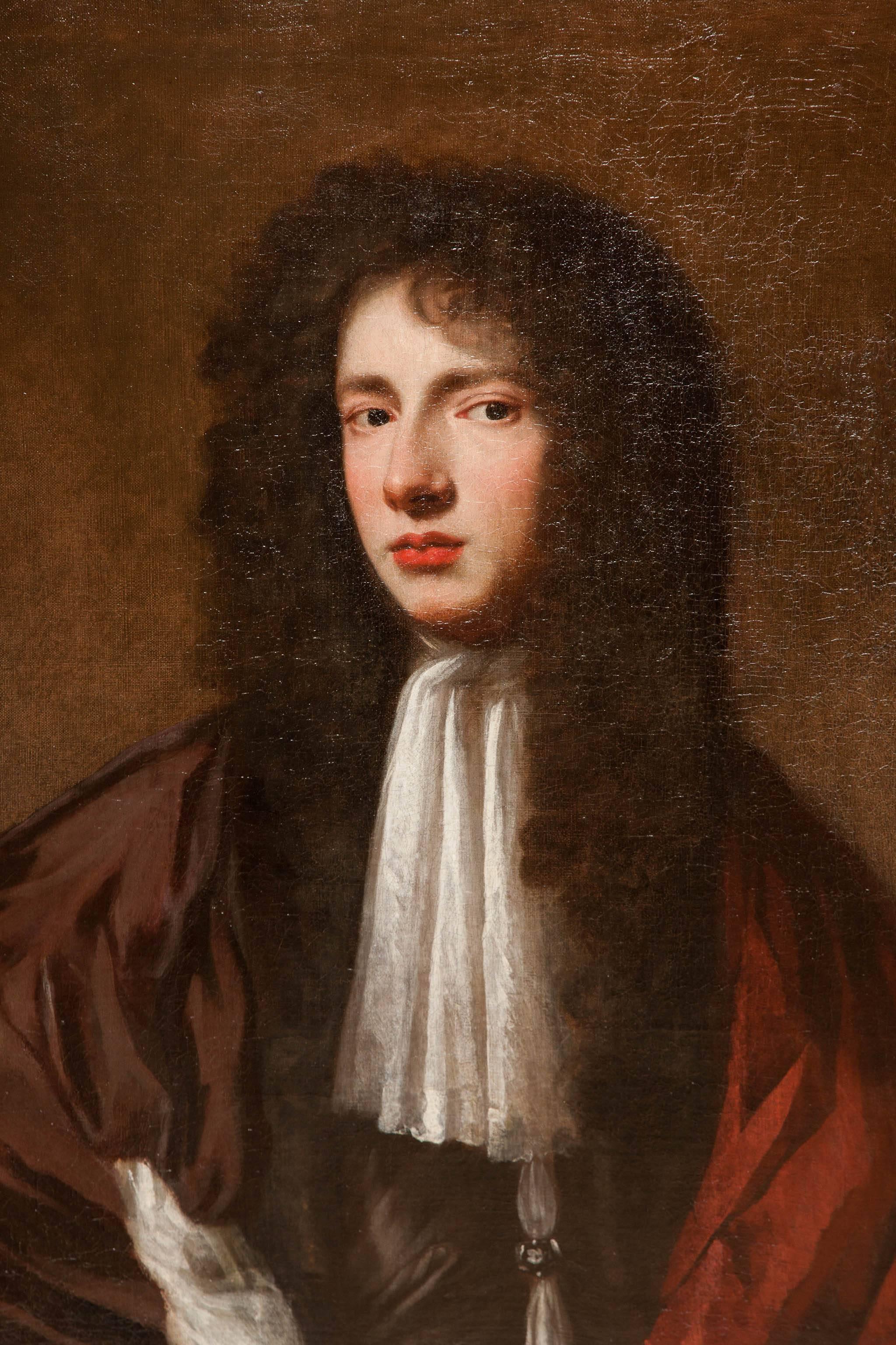 Enigmatic portrait of a young gentleman, England, circa 1680 in an original frame bolection frame. The sitter has a charming, quizzical, enigmatic expression. Possible attribution to Jacob Huysman who was active in this period. 
Good condition,