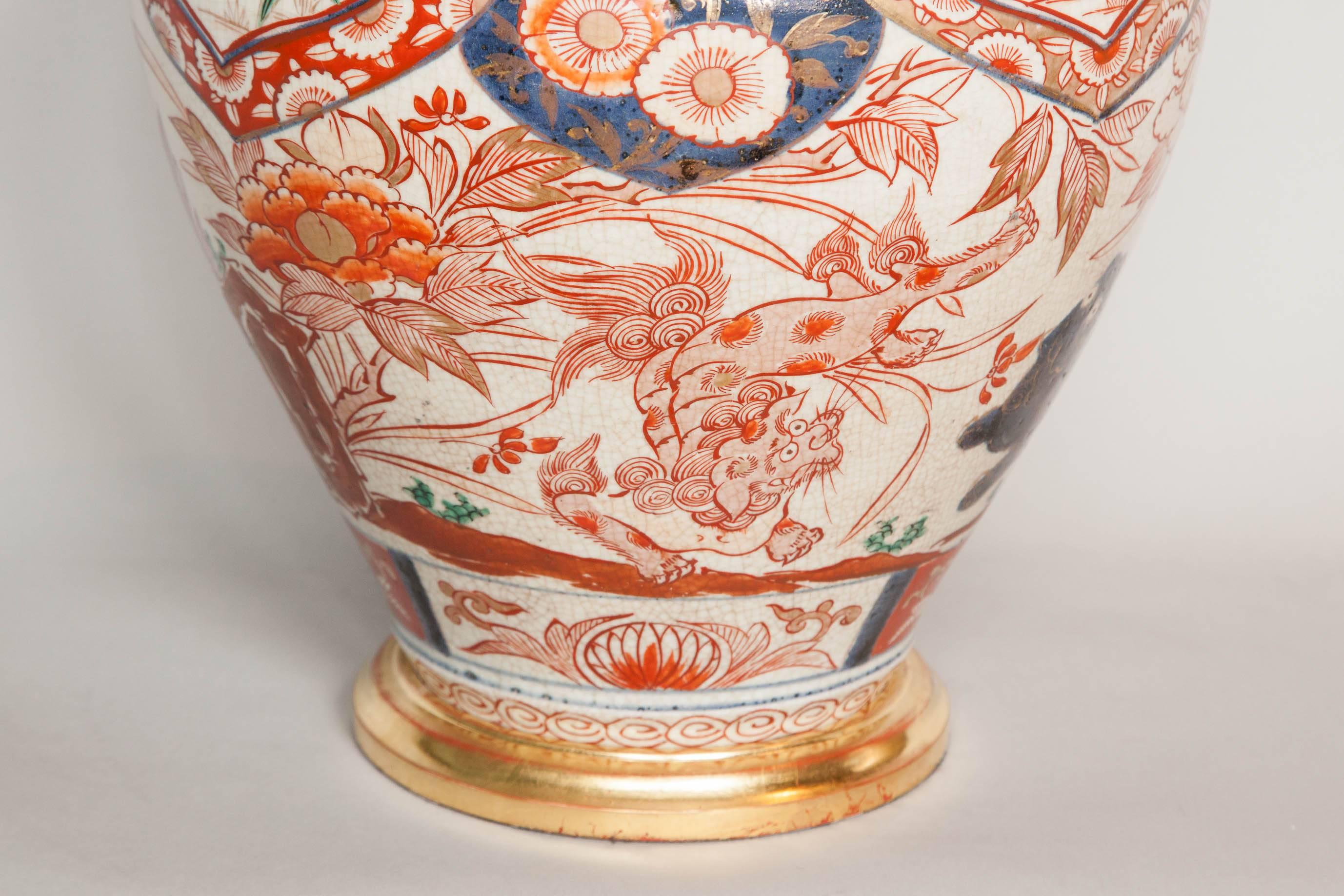 Interesting pair of bulbous Japanese Imari vases, one in perfect condition and one with few restoration on the back dating from ca. 1680-1700.
The decoration features a generous use of red and orange making this pair of lamps particularly decorative