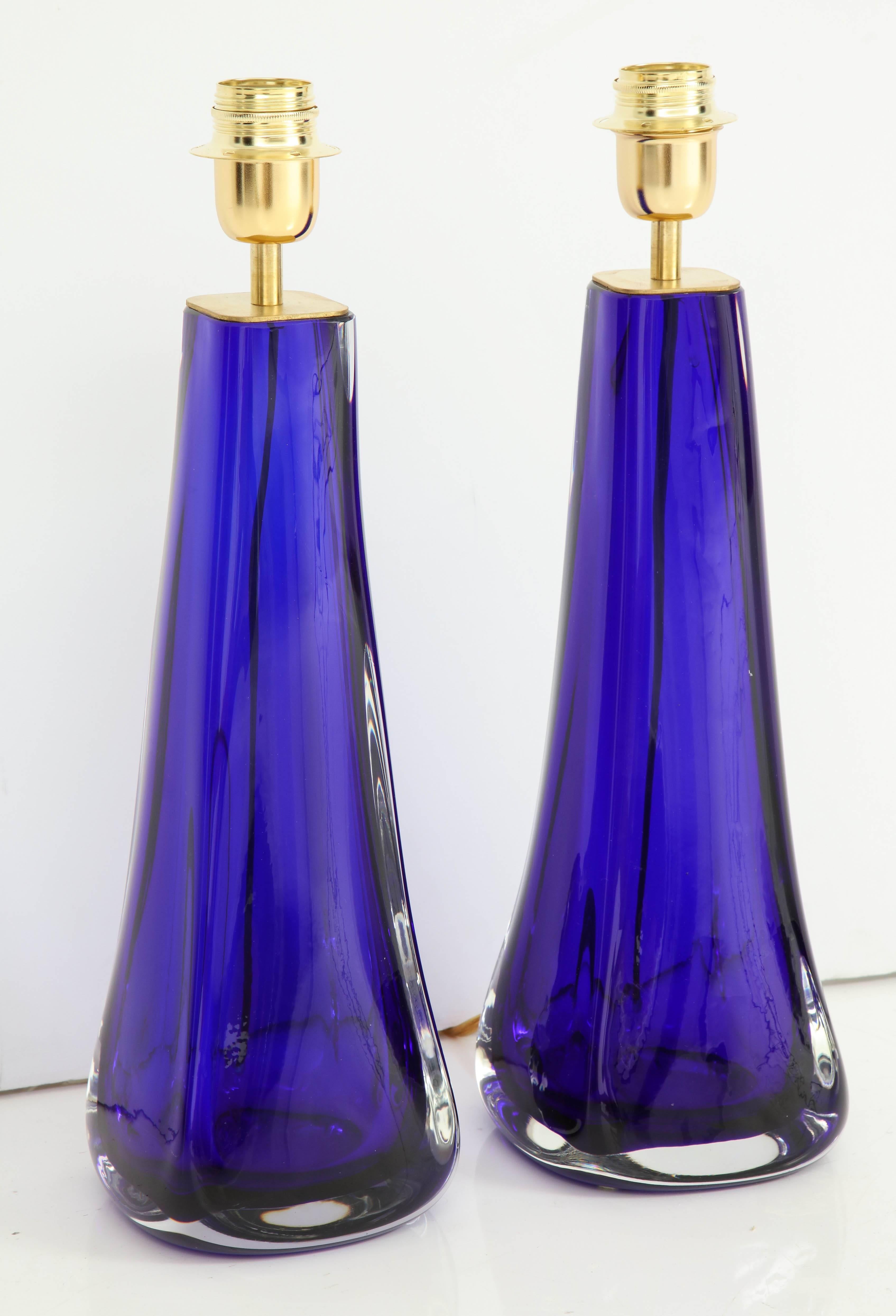 Pair of stunning Murano cobalt blue handblown glass lamps. These lamps have been made in the “Sommerso” technique. The height to the top of the glass is 14.75”. Sommerso (lit. "submerged" in Italian), or "sunken glasses", is a
