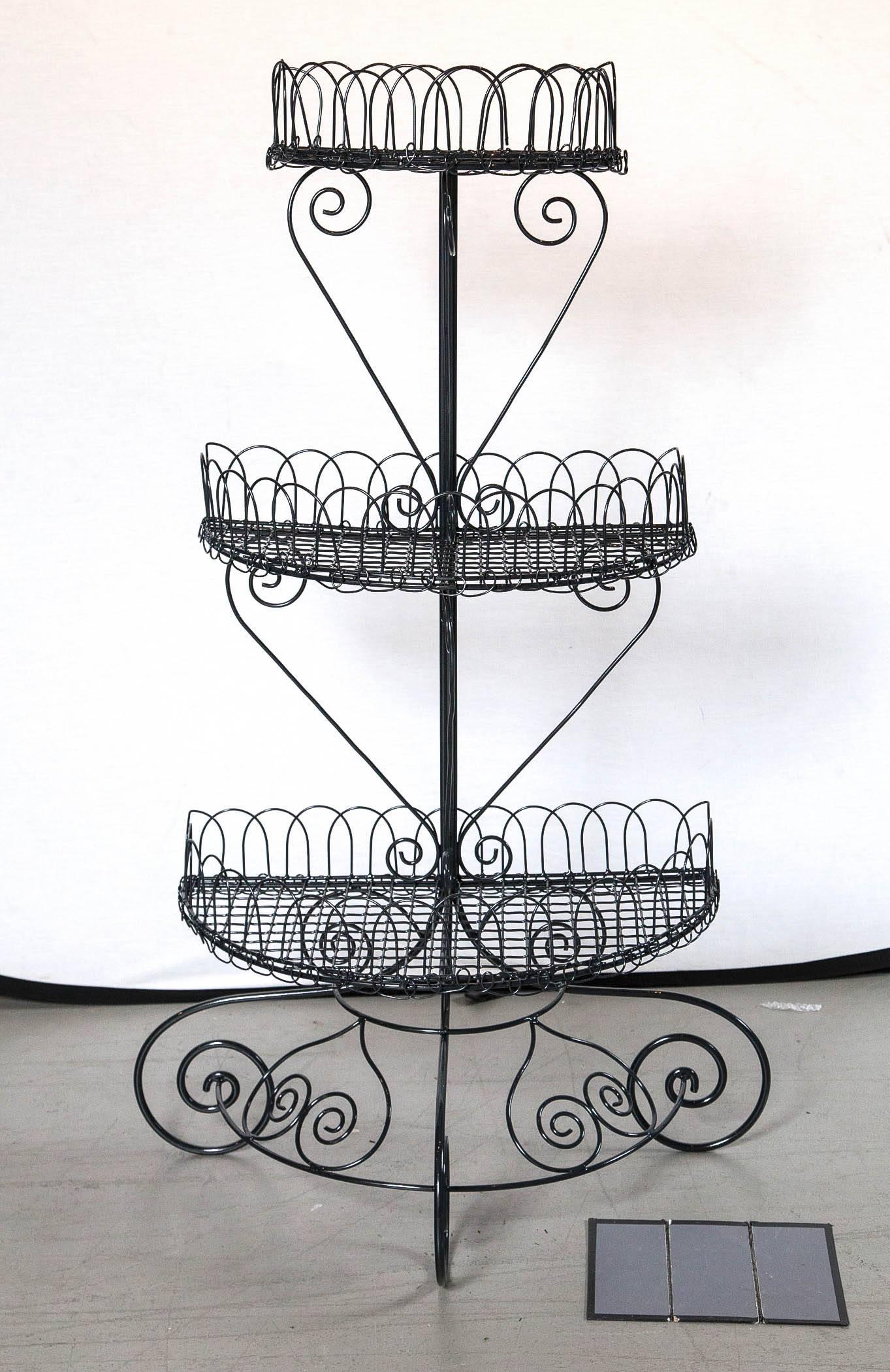 Powder coated French style half circular tiered plant stand.