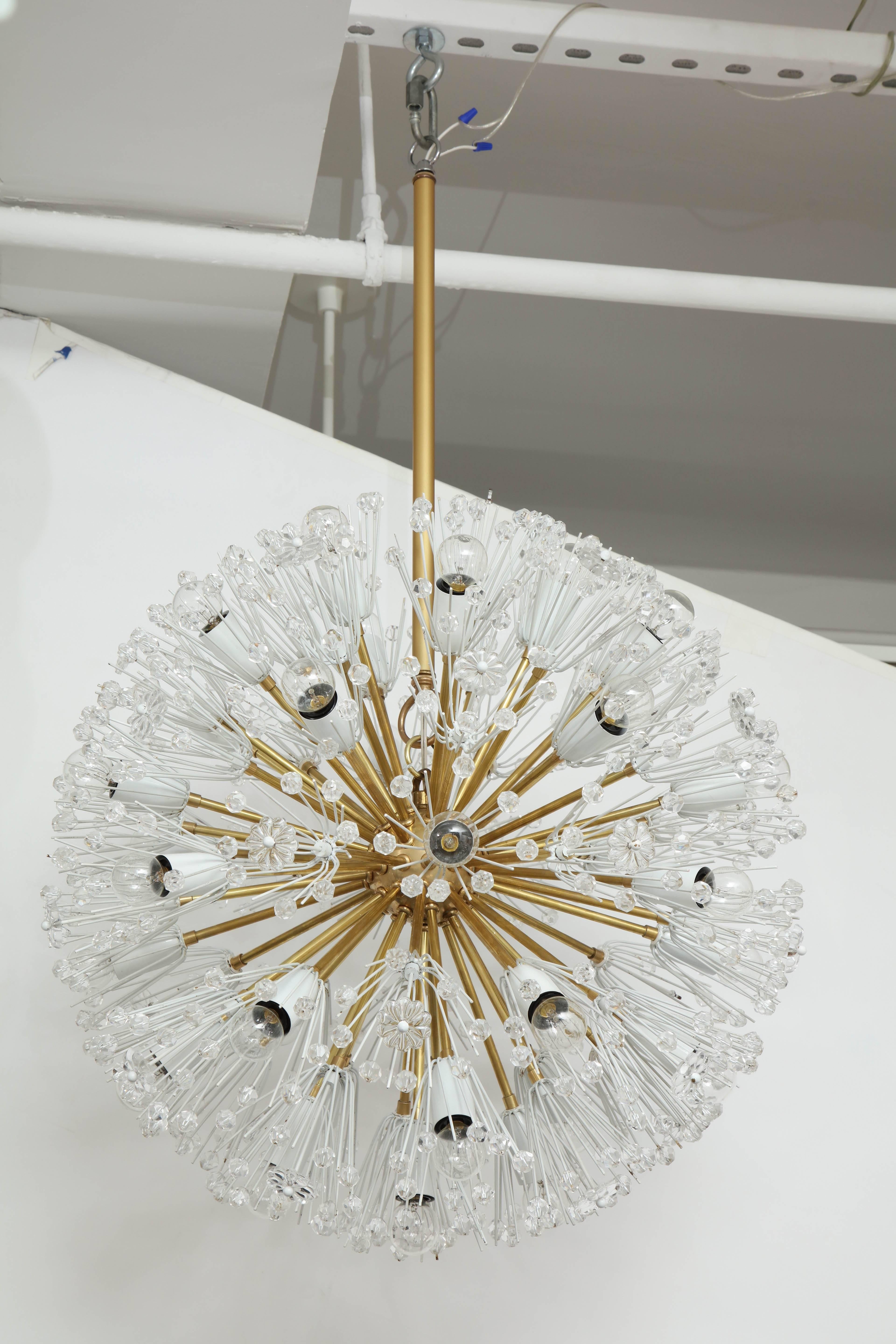 Giant 1950s Emil Stejnar snowball chandelier. 
There are thirty one lights which when illuminated make this chandelier with the copious amounts of Austrian crystal elements glisten into a statement piece.
The chandelier has been newly rewired for