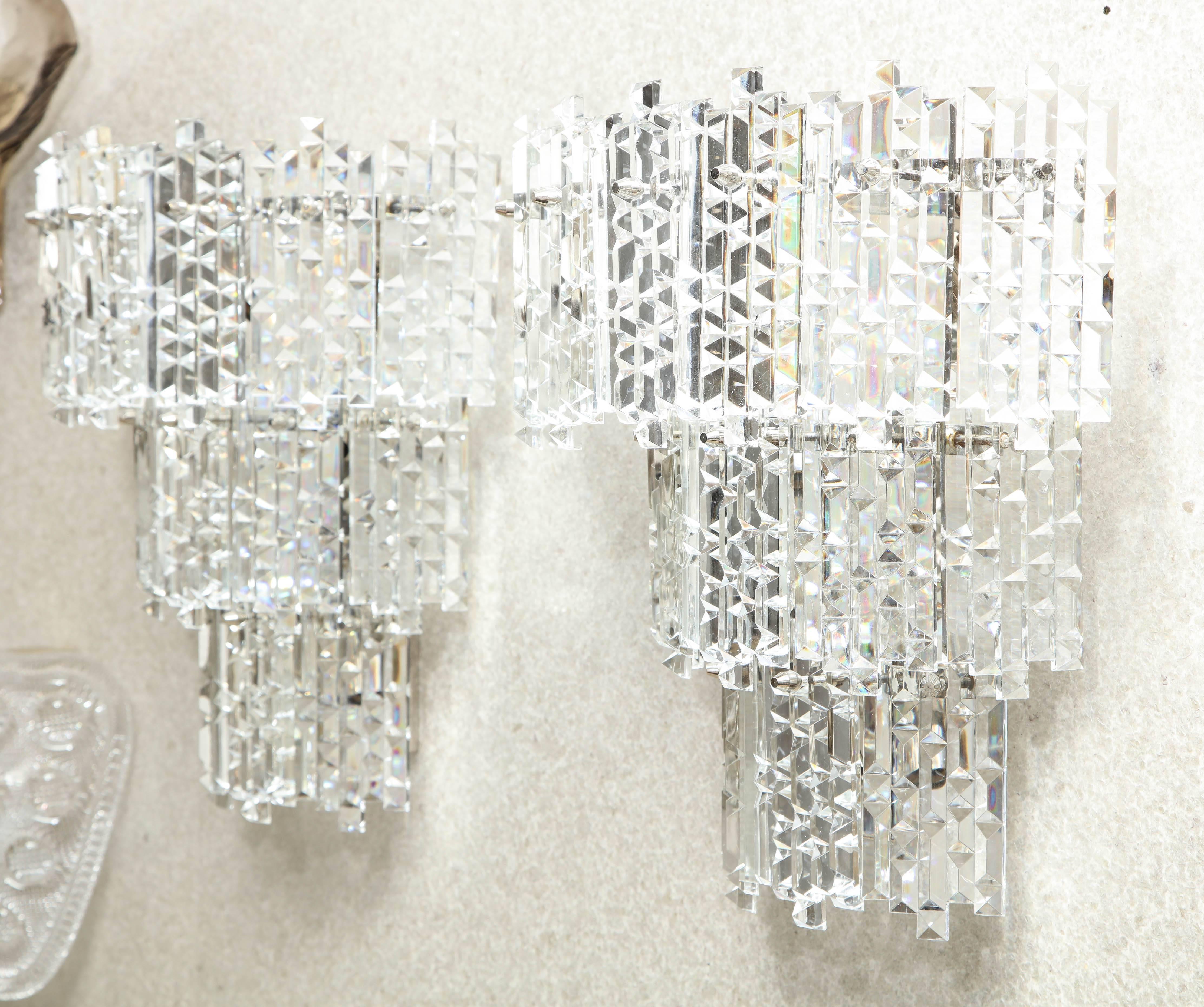 Pair of impressive three-tier Austrian crystal sconces with rectangular prisms featuring geometric facets. rewired for use in the USA using candelabra type bulbs. Made in the 1970s with a strong Art Deco influence.