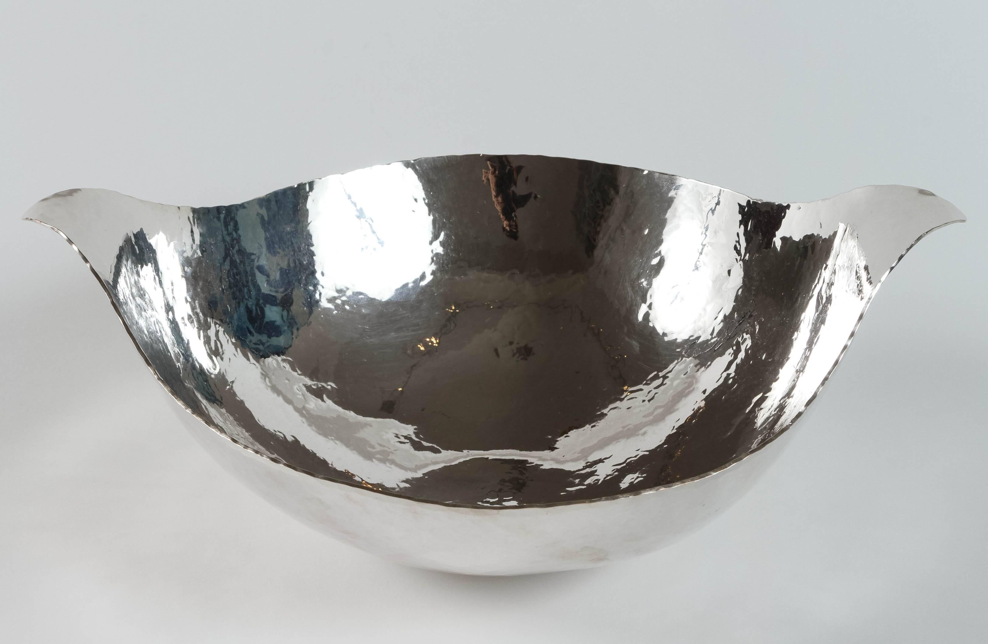 Ben Caldwell creates by hand copper and sterling silver pieces, bowls, trays and sculptures using traditional smithing techniques. The hand-wrought texture covering every surface is a signature of Ben's work.