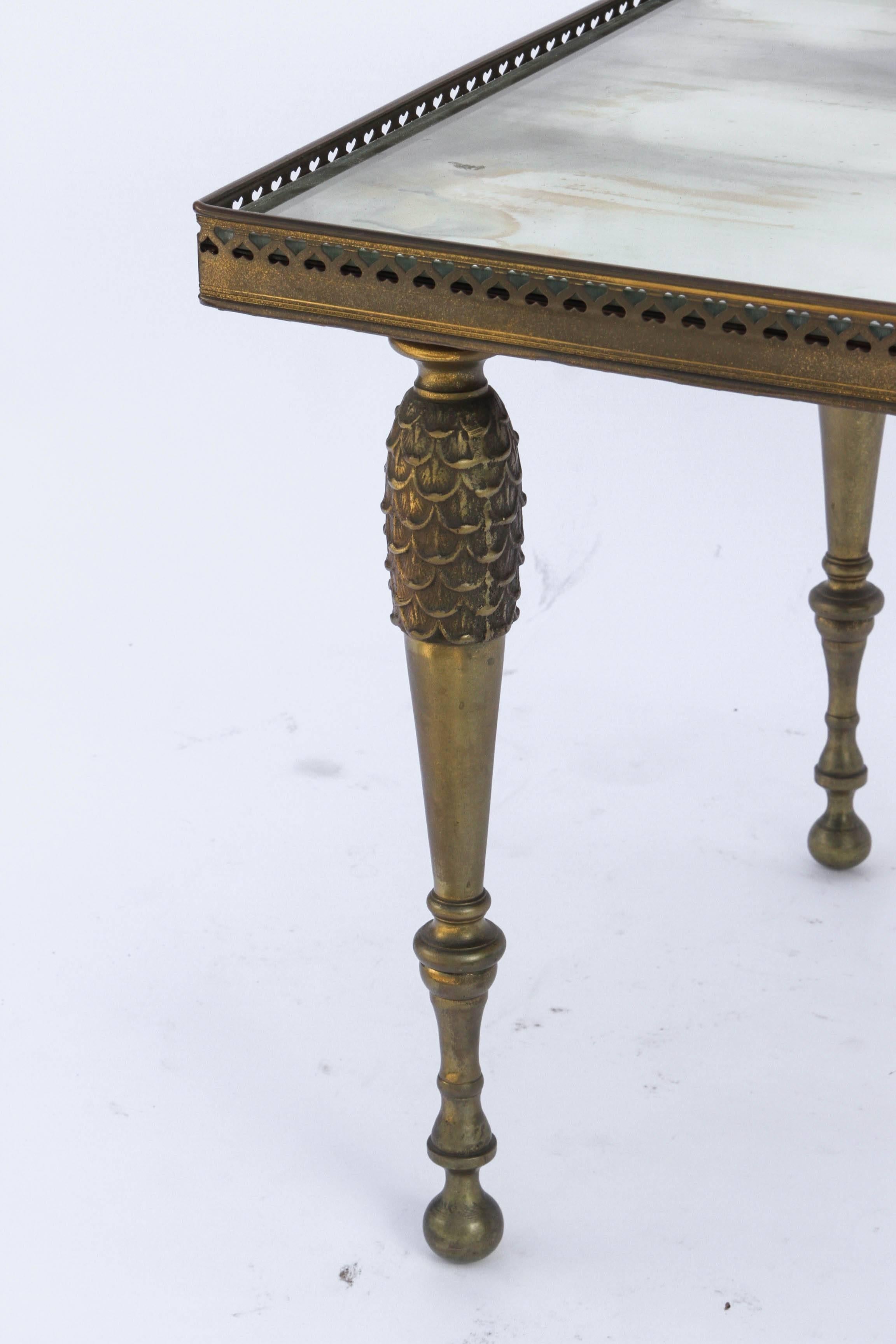 Pair of Mid-Century bronze and mirrored occasional tables with gallery top.