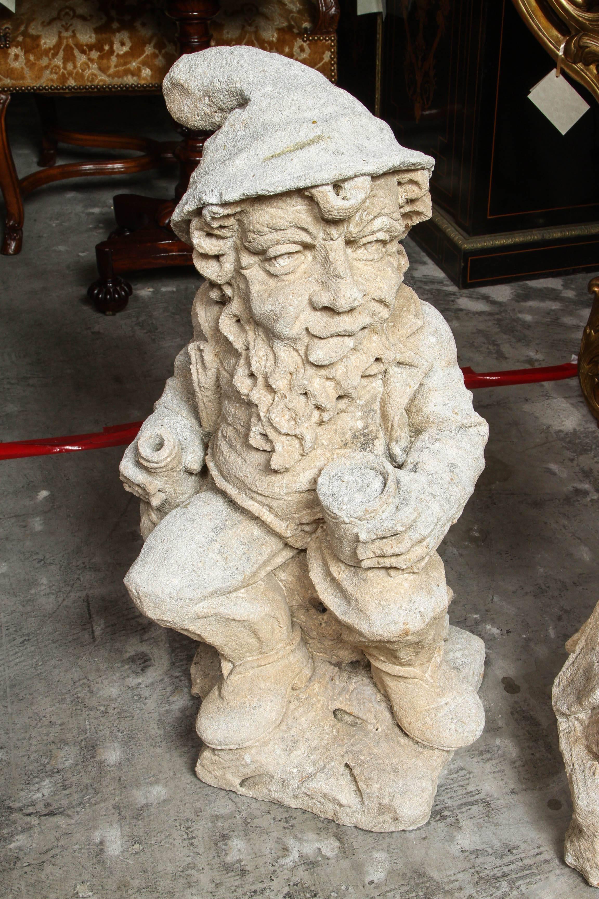 Group of four whimsical French carved limestone Gnomes from the early 1900s.