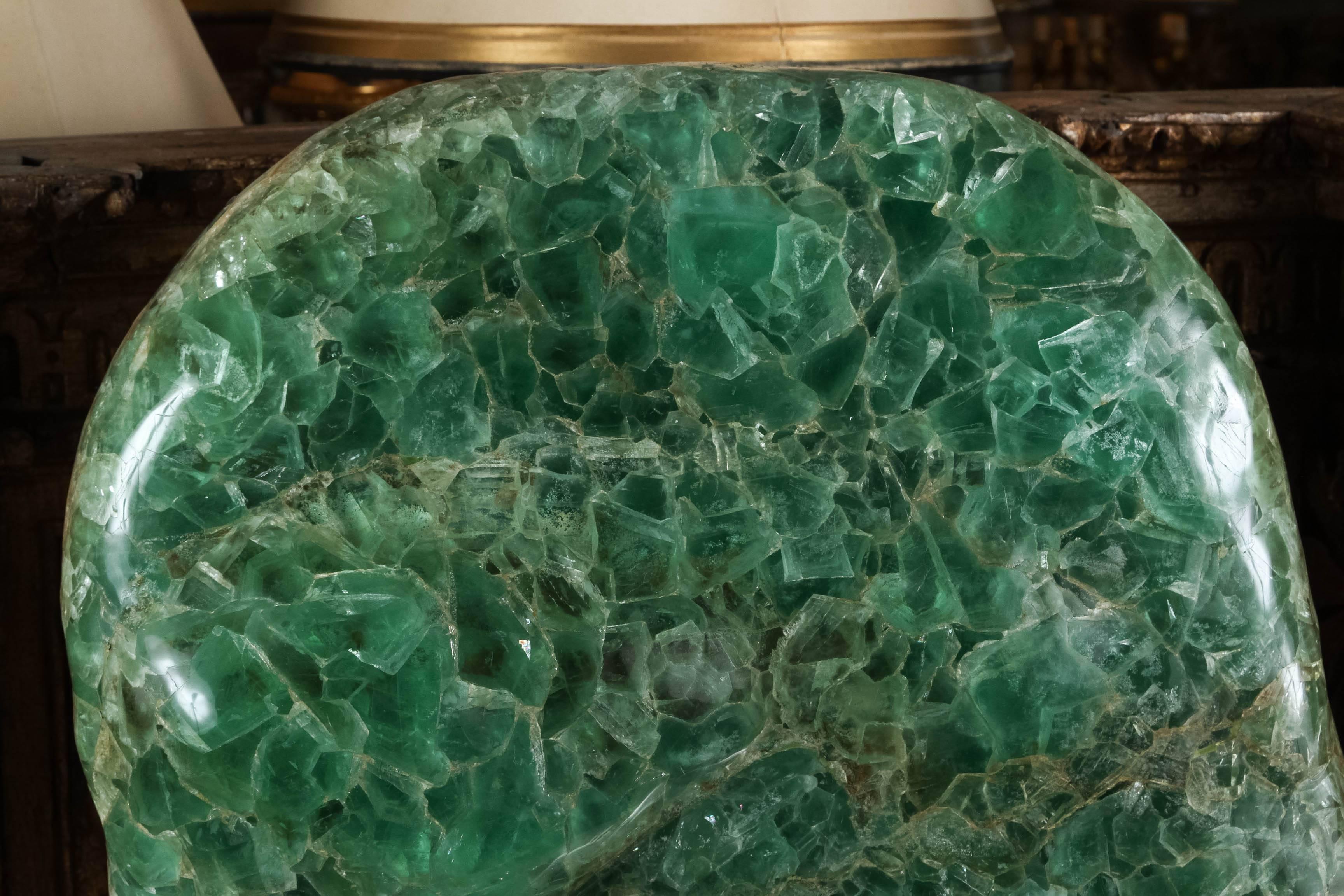 Impressive large-scale green fluorite sculpture mounted on silver leaf base.