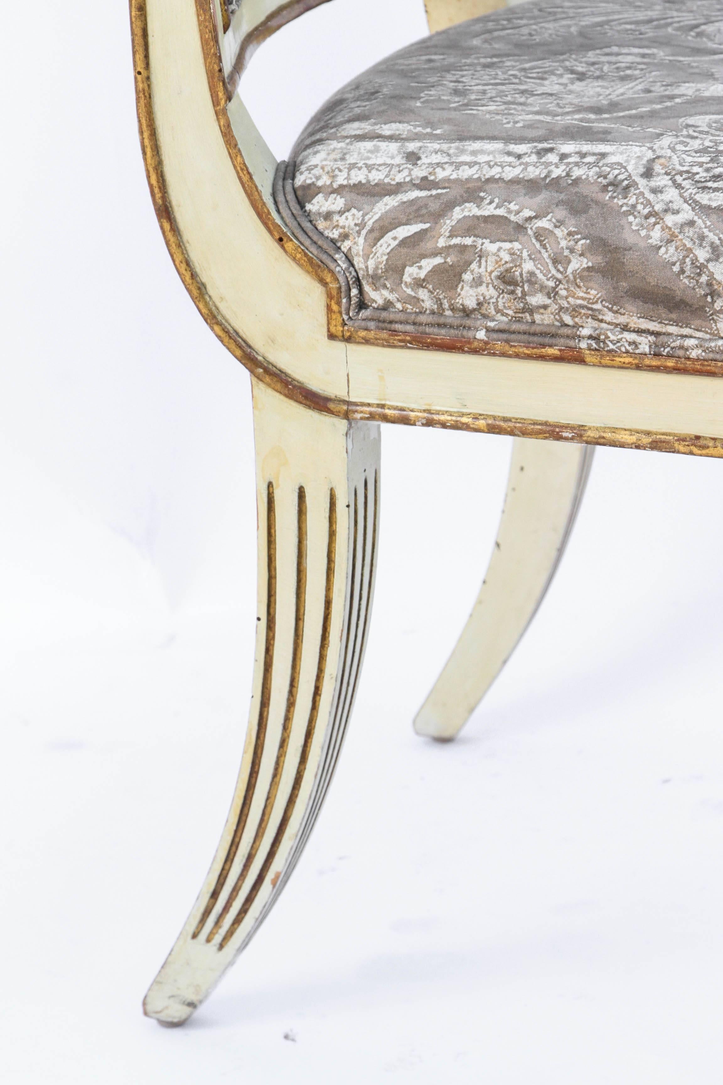 Giltwood Group of Twelve 19th Century Italian Gilded and Carved Saber Dining Chairs For Sale