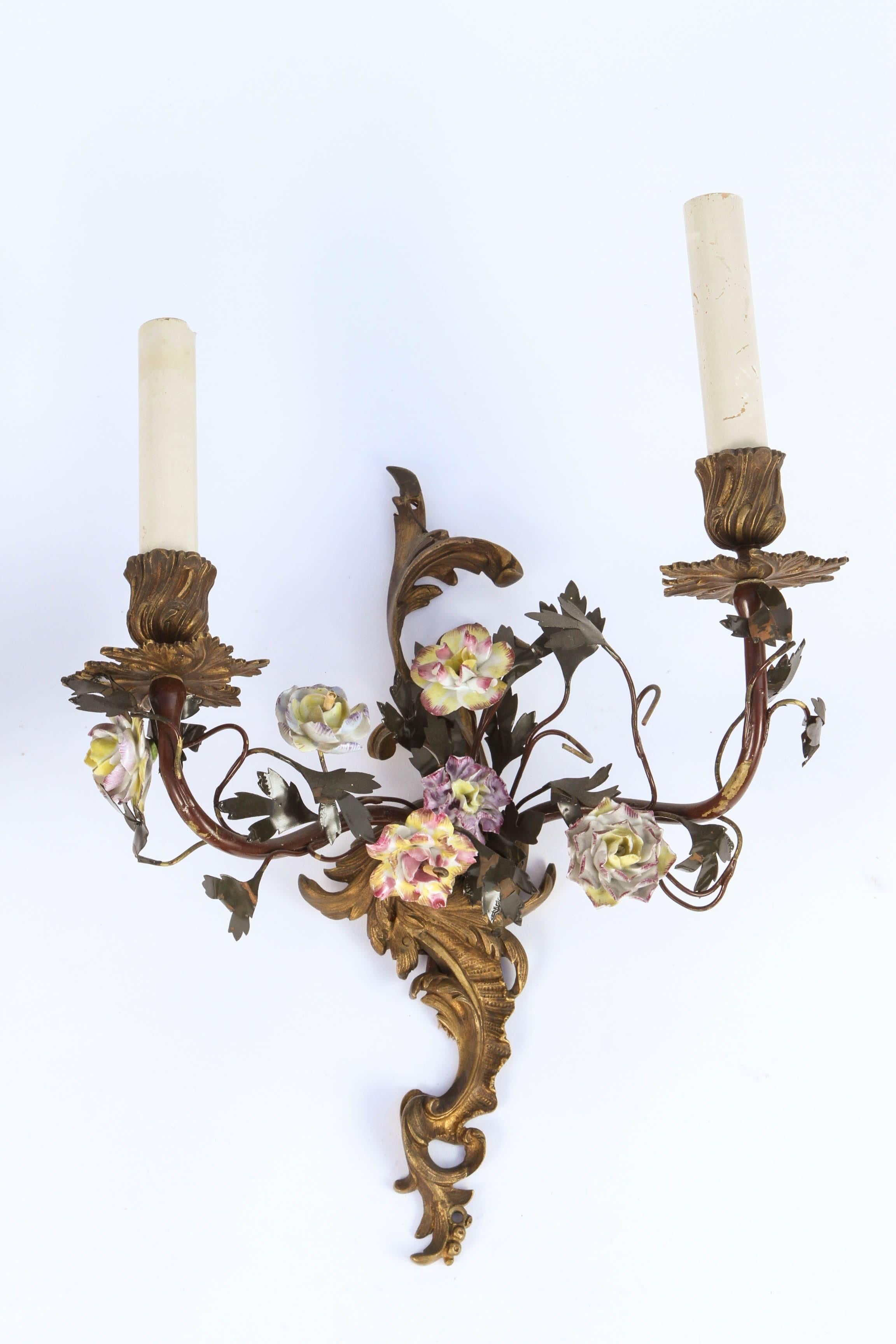 Pair of 1900s French bronze, toile and porcelain flower sconces. These sconces are sold as a pair and have been newly wired. The price below is for one pair but there is two pair available for separate purchase.