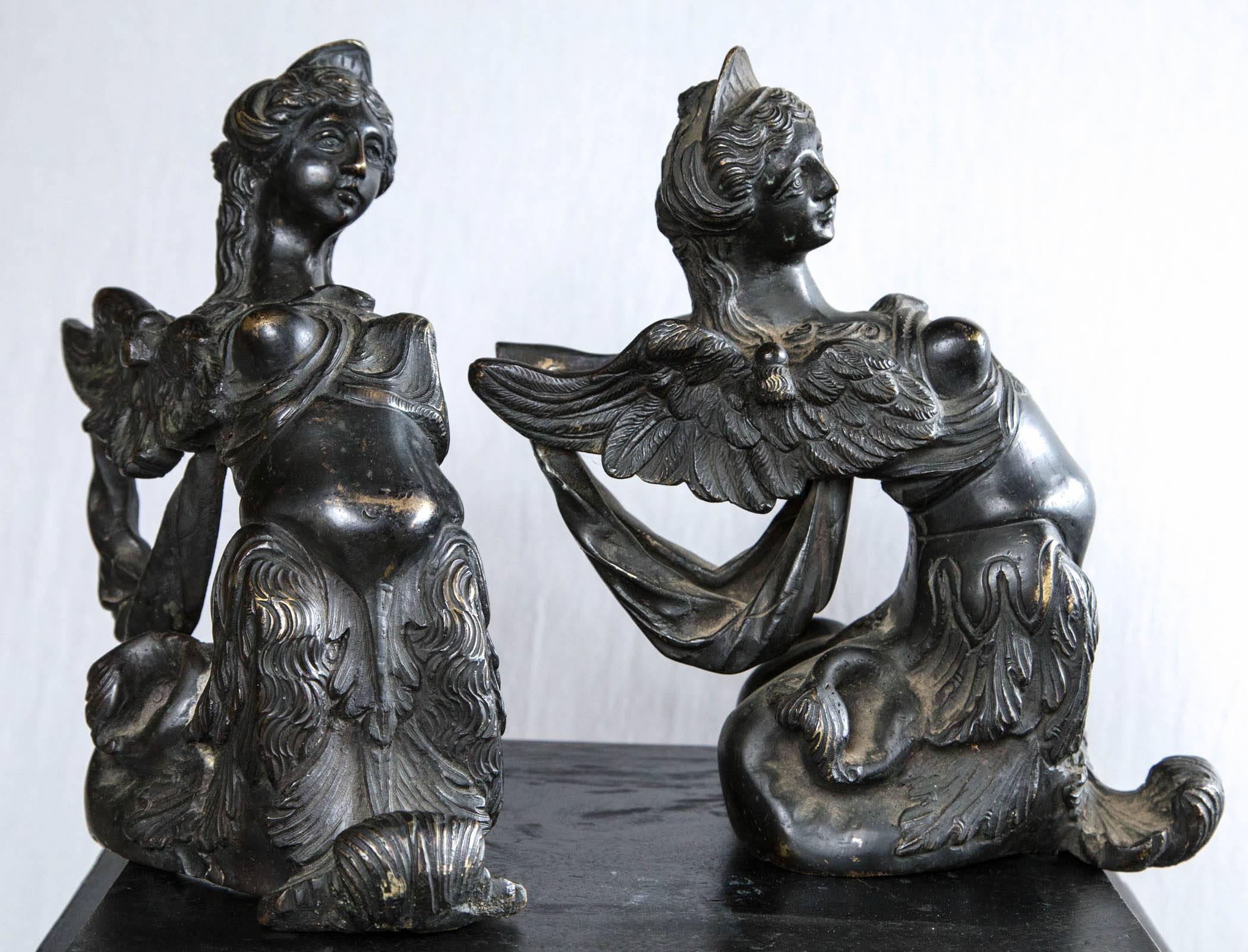 Dating from the 17th century, this pair were once base supports for large candelabra. They have a rich black/brown patina. They have wings and flowing robes with bare breasts. In keeping with the quality of Italian Renaissance bronzes, they are well