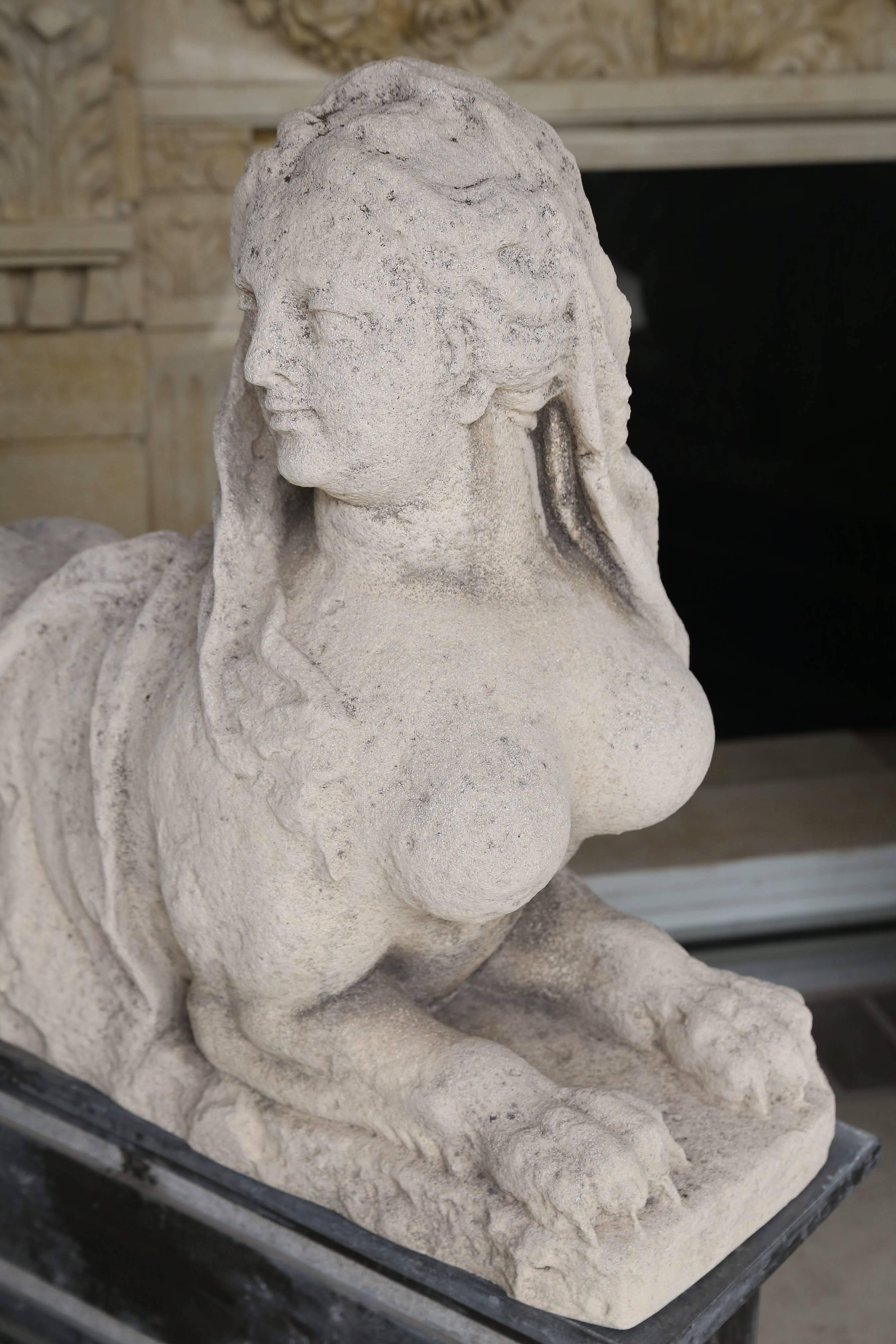 Limestone sphinx pair opposing figures on newer marble bases
The bases measure 12