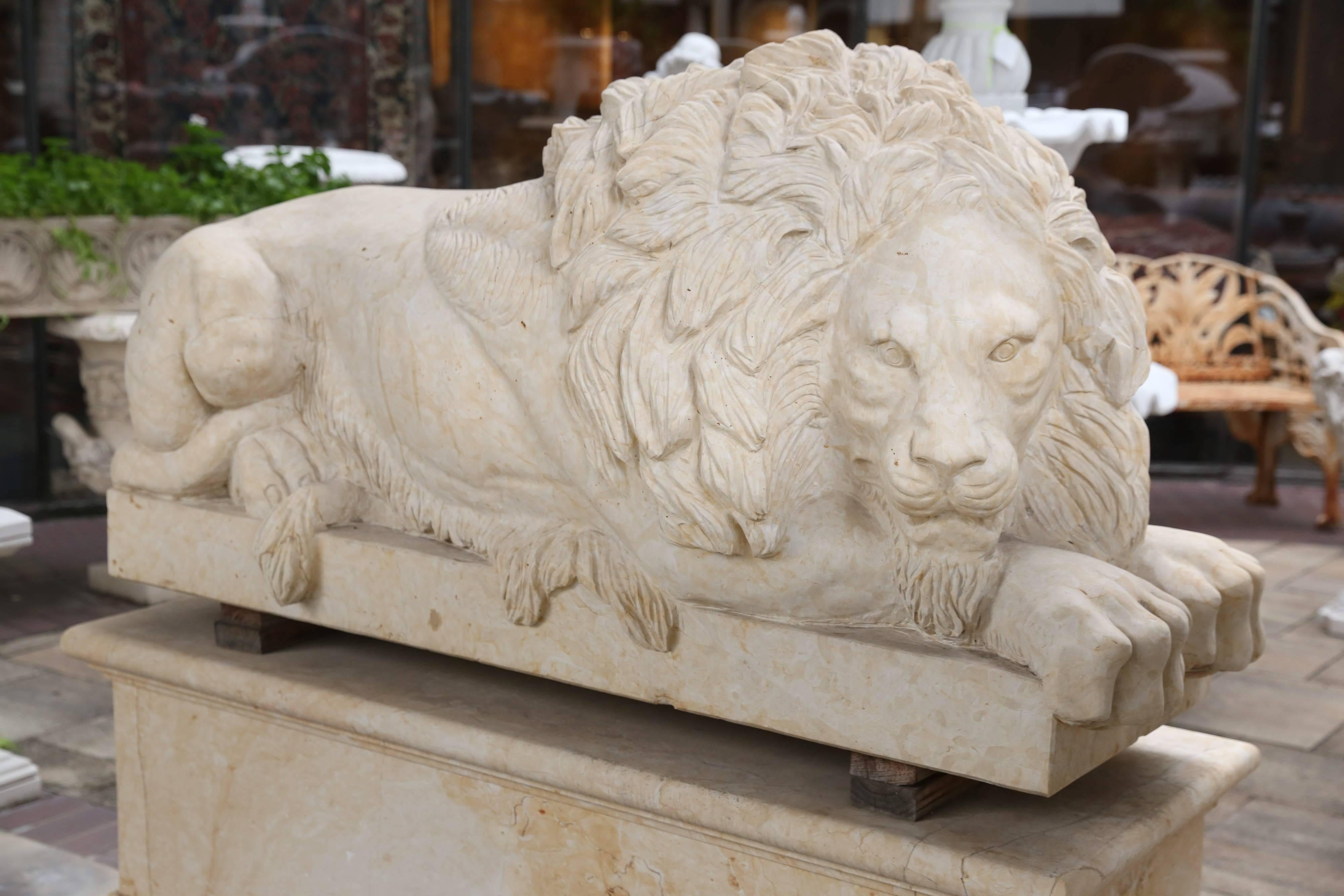 Large recumbent lions resting on solid marble pedestals. The color is a soft
cream color. Beautifully carved! They would enhance an entrance to
A large entryway or garden area. Dimensions of pedestals: 24 D by 64 W
By 20.5 in high. These are