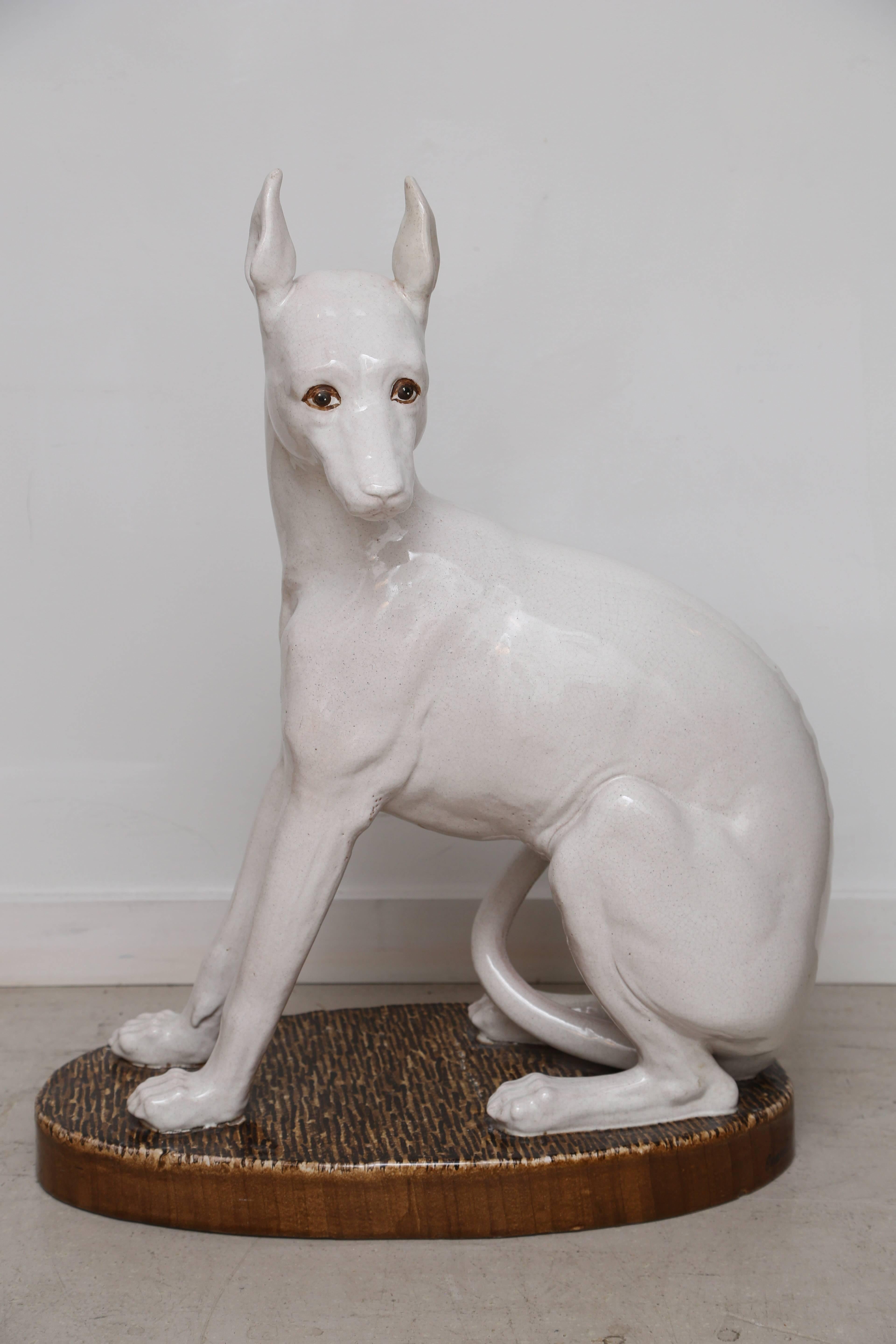 Vintage white whippet statue signed Italy on base.