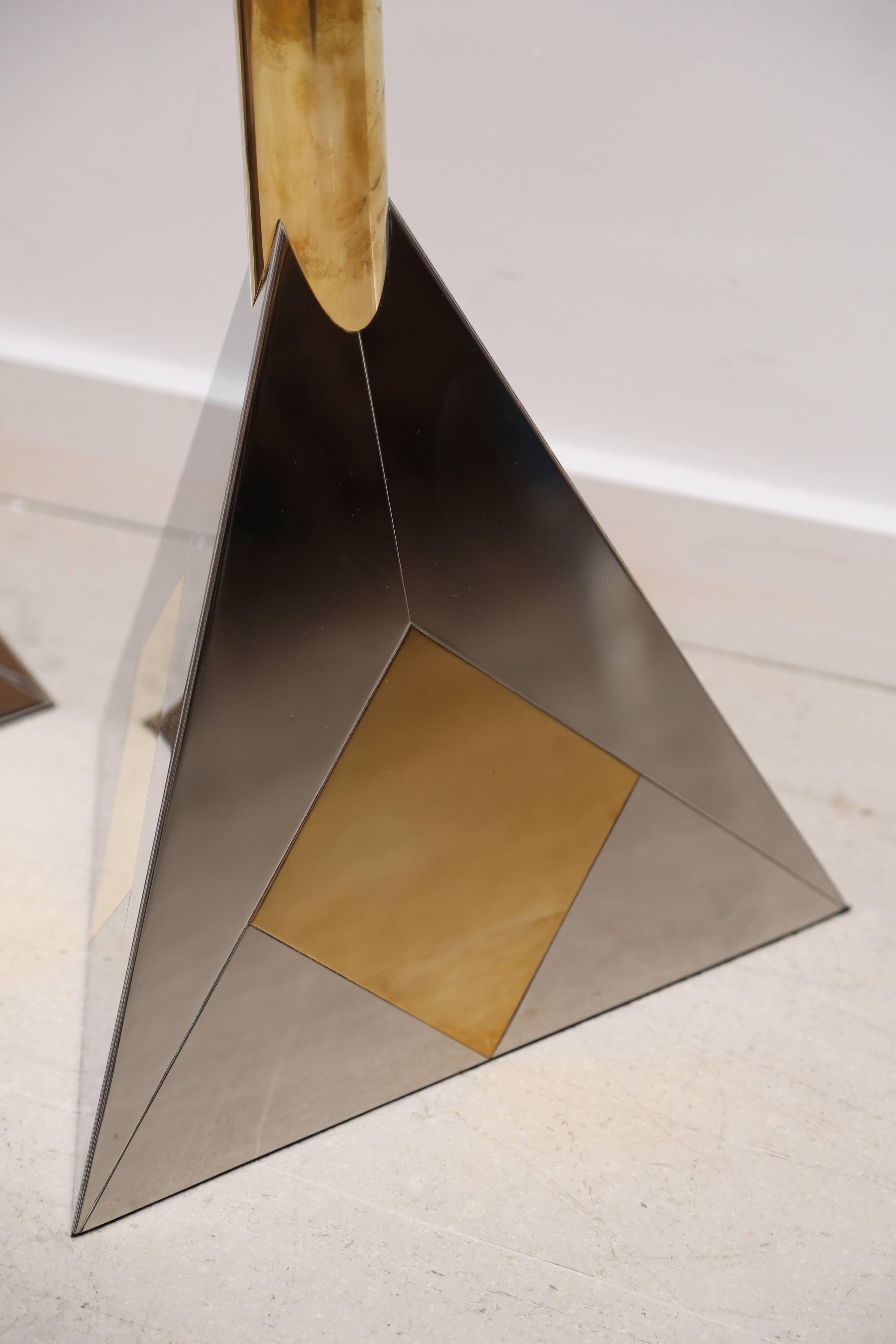 Pair of two-tone high polished Modernist triangular lamps, rewired for US standards.