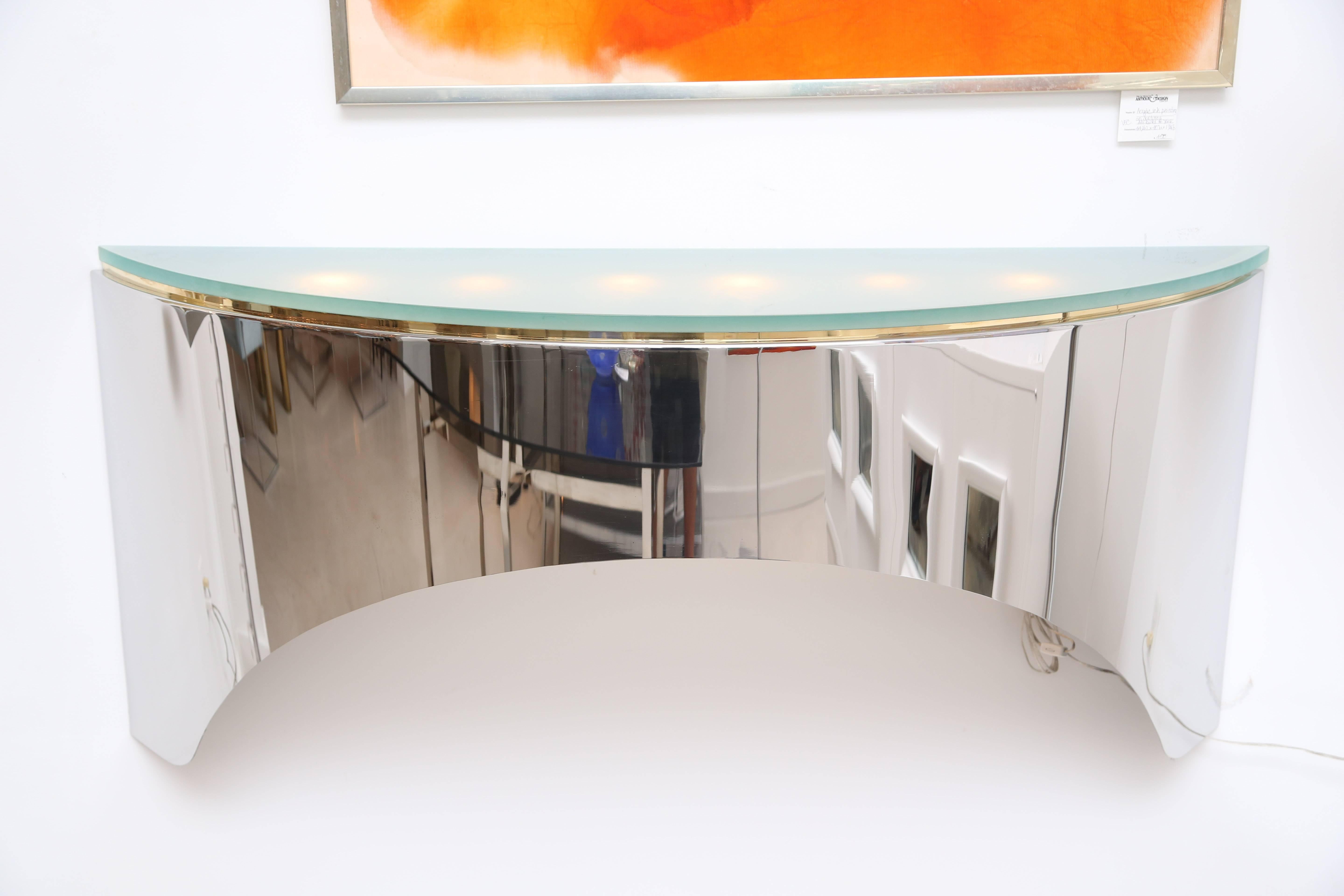 Vintage polished steel floating wall mount console with illuminating plateau designed in the style of Karl Springer. The top is made of sand blasted glass.