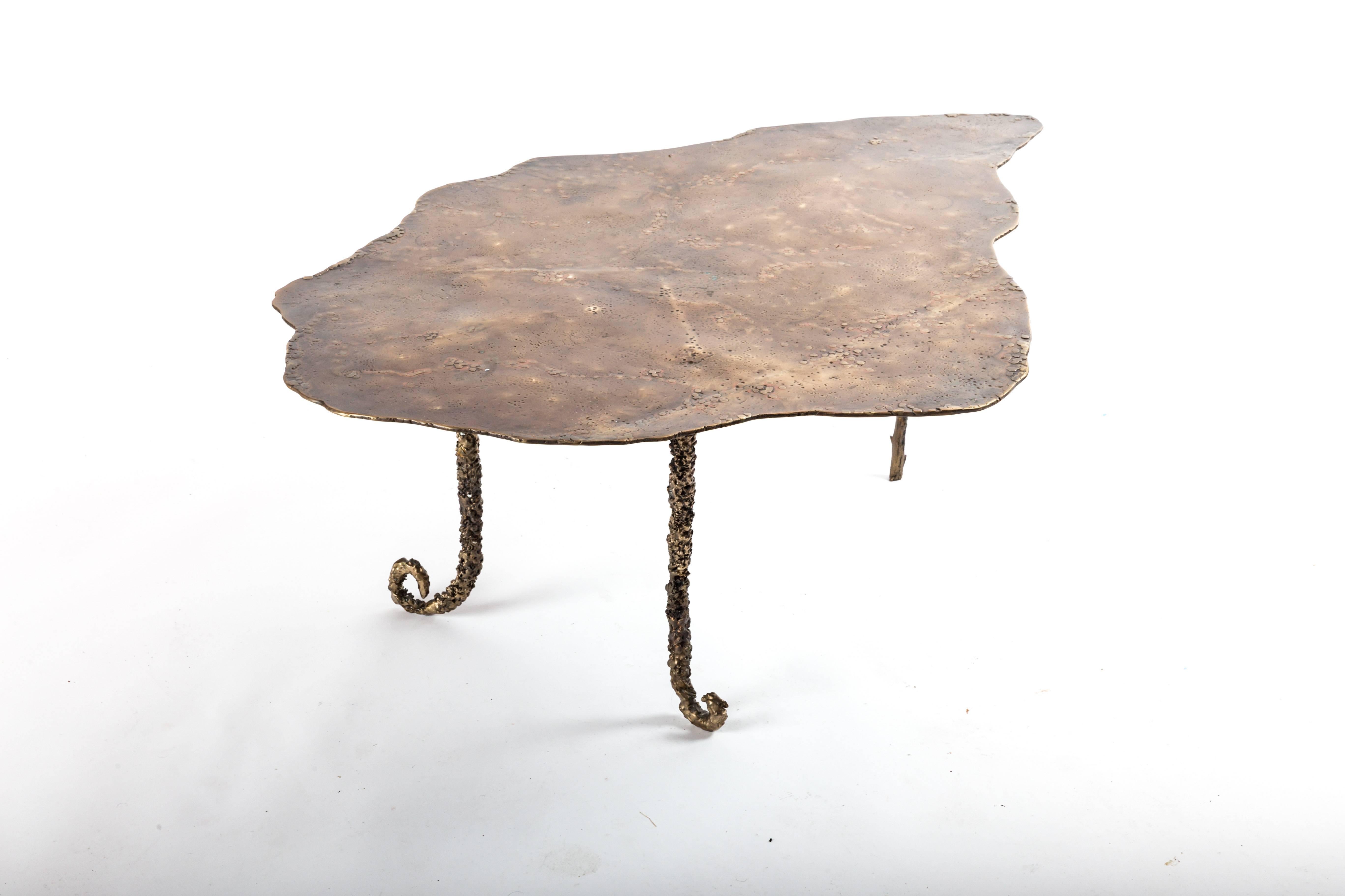 Custom-made cast bronze coffee table. Designed by Athena Calderone and crafted by Vanessa Monk of Monk Designs. The base of the table was inspired and cast from actual plant stalks found in nature, giving the legs their amazing nubby tactile