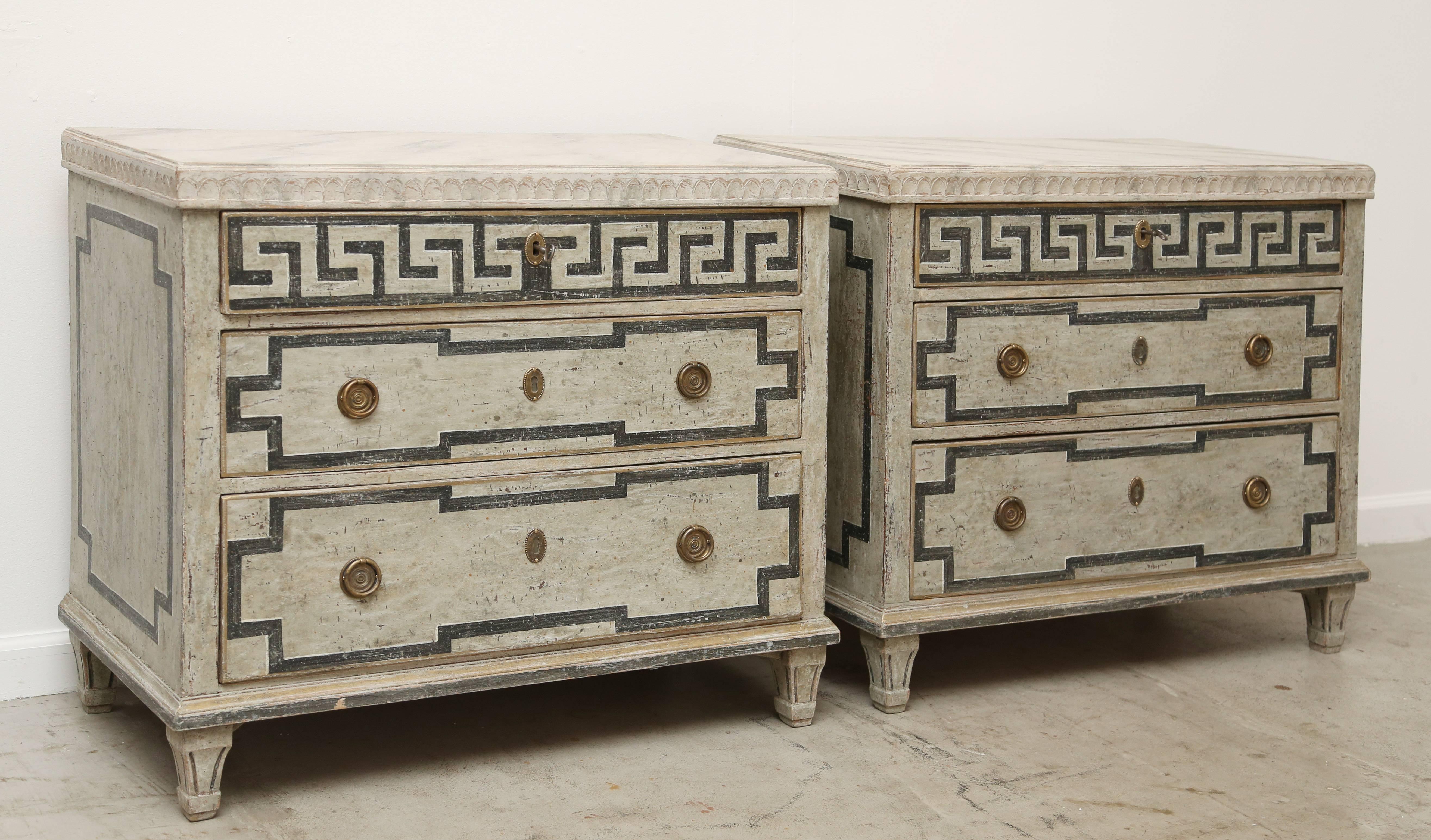 Pair Antique Swedish Gustavian Style very decorative painted chests with
black Greek Key motif on the top drawer and black linear panels on the lower drawers and sides, the background color is Swedish distressed gray. Top is painted a faux gray