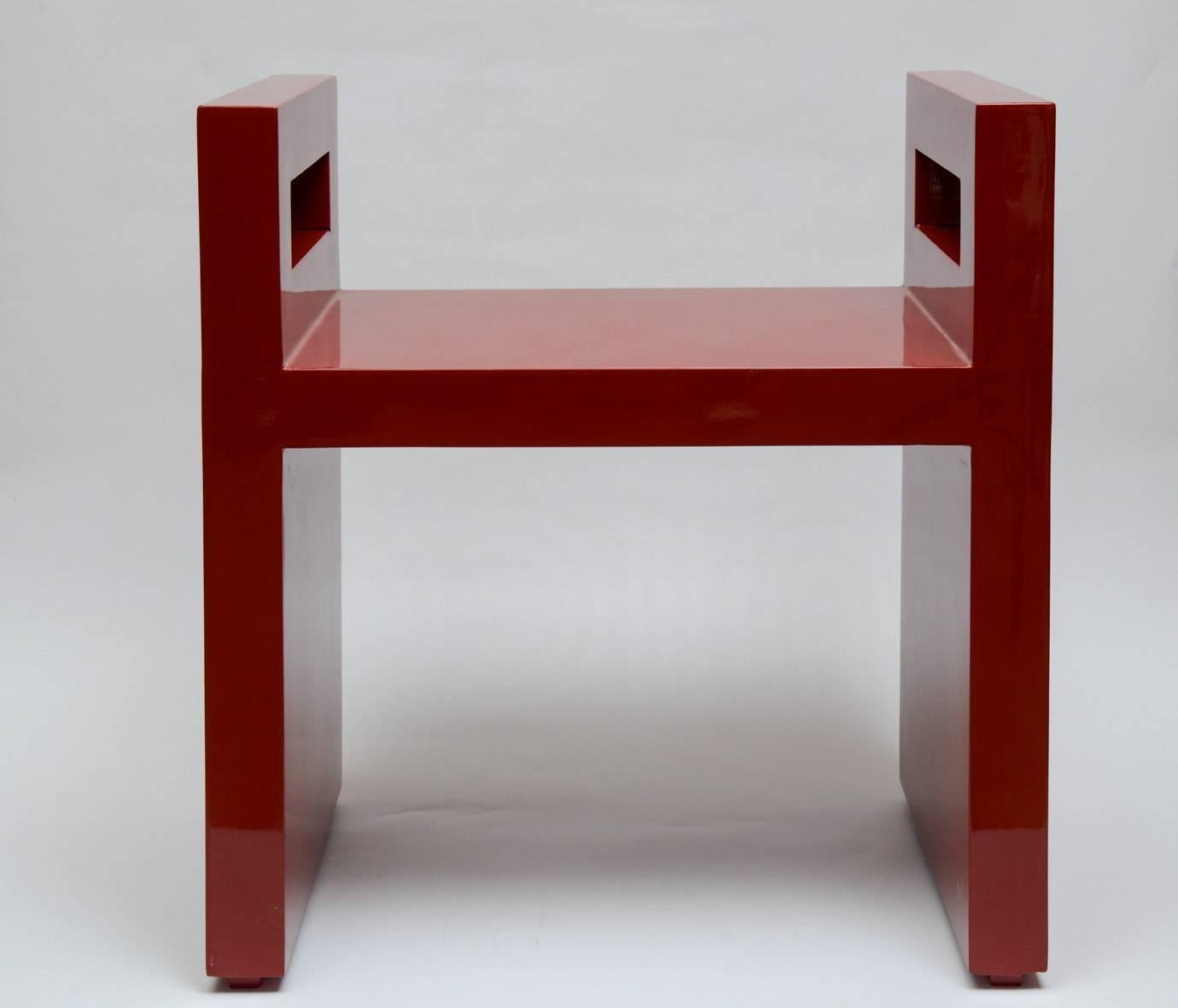 Pair of benches in wood lacquered in red.
