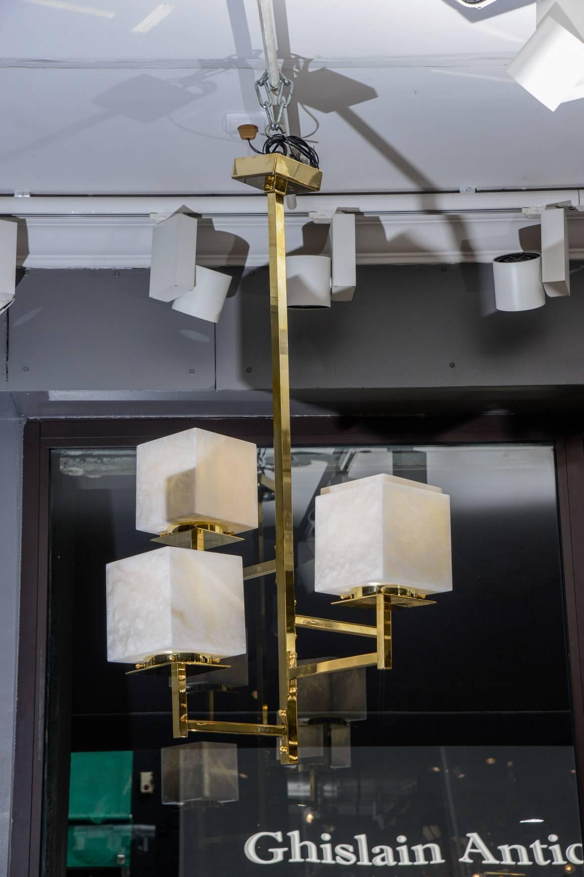 Pair of alabaster chandelier, four alabaster cubes per chandelier, led lights, creation by Studio Glustin.
Could be sold by unit.