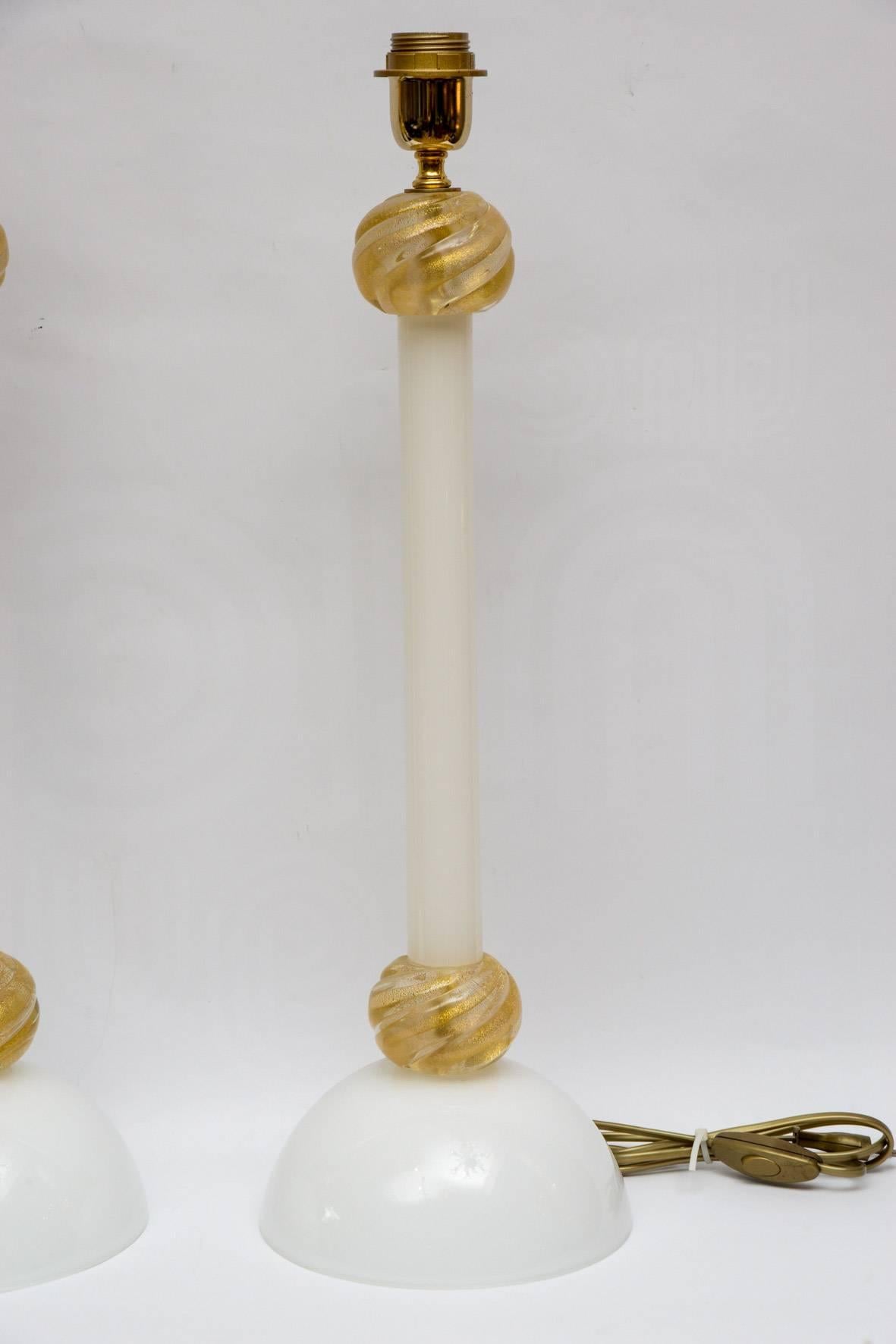 Pair of table lamps in white and gold Murano glass.