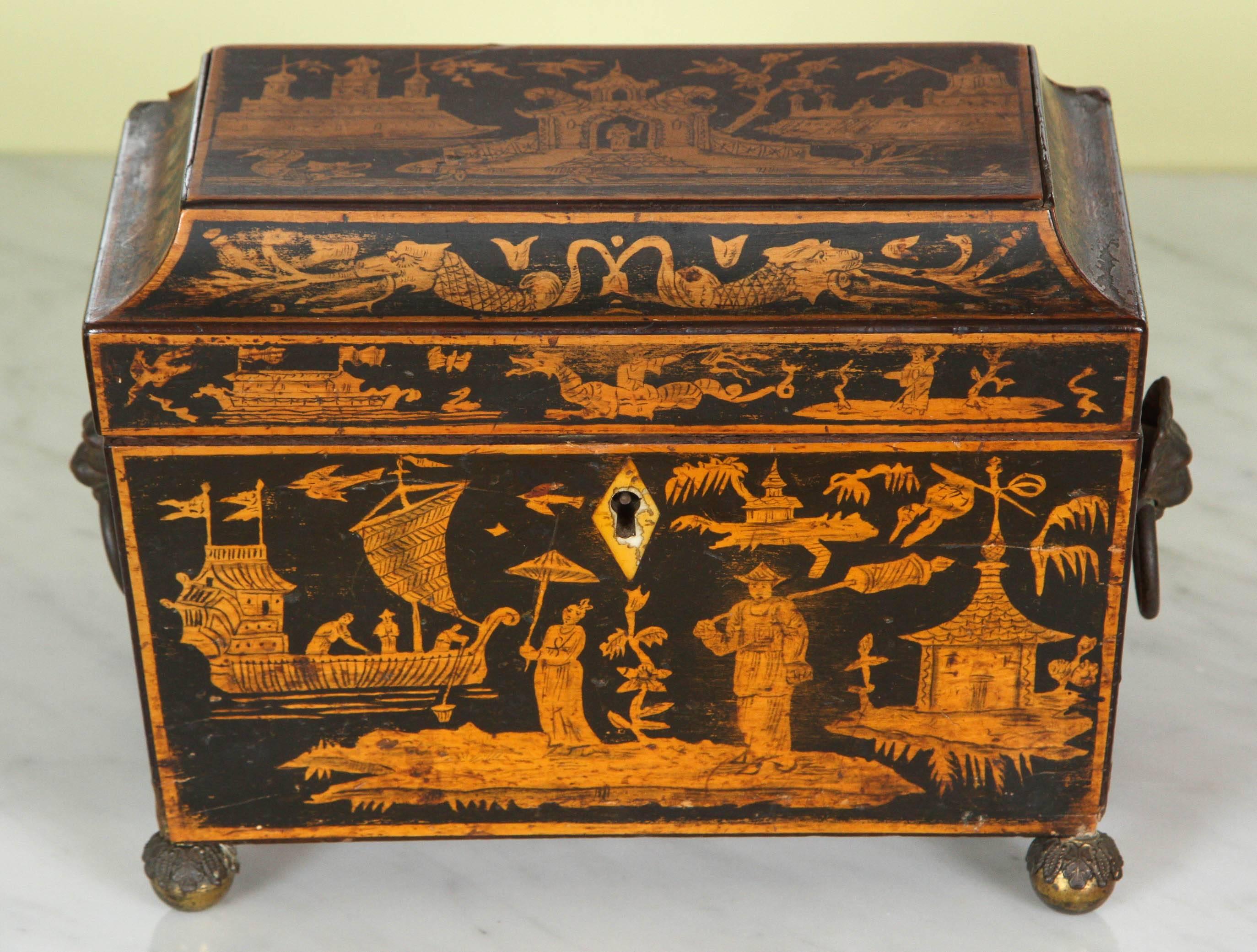 This beautiful tea caddy top depicts a naive Chinese scene with a few figures, three buildings and Naturalistic foliage with a concealed interior containing penwork decorated lids. The tea caddy is decorated on all four sides and stands on brass