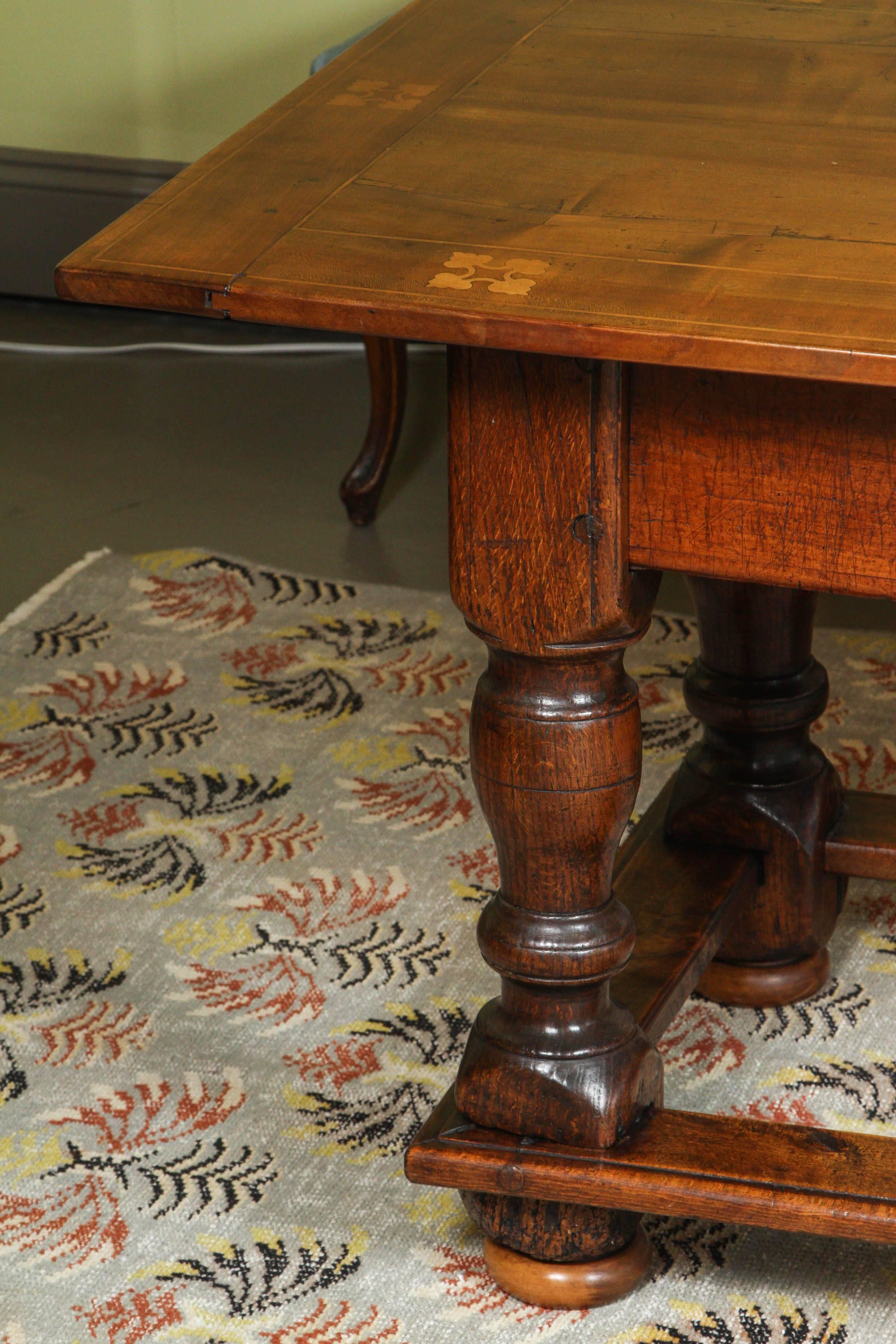 South German walnut Refectory table with beautifully inlaid top and carved drawers, dated 1765.