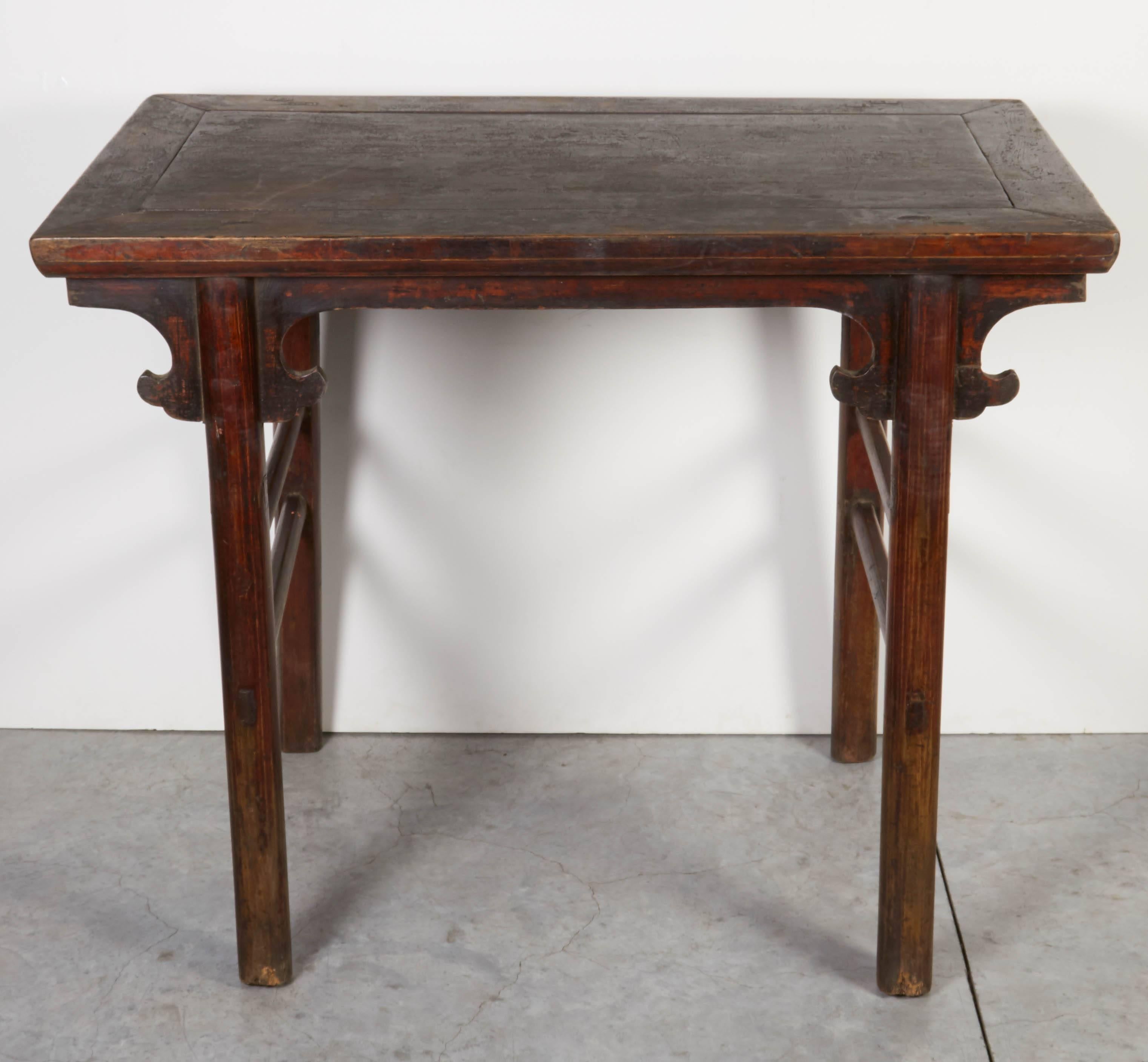 A simple, Ming stye 19th century, Chinese wine table with fabulous patina and beautiful details. The size of this wonderful table makes it ideal for use as a vanity or small work desk. From Shanxi Province. 

T579.