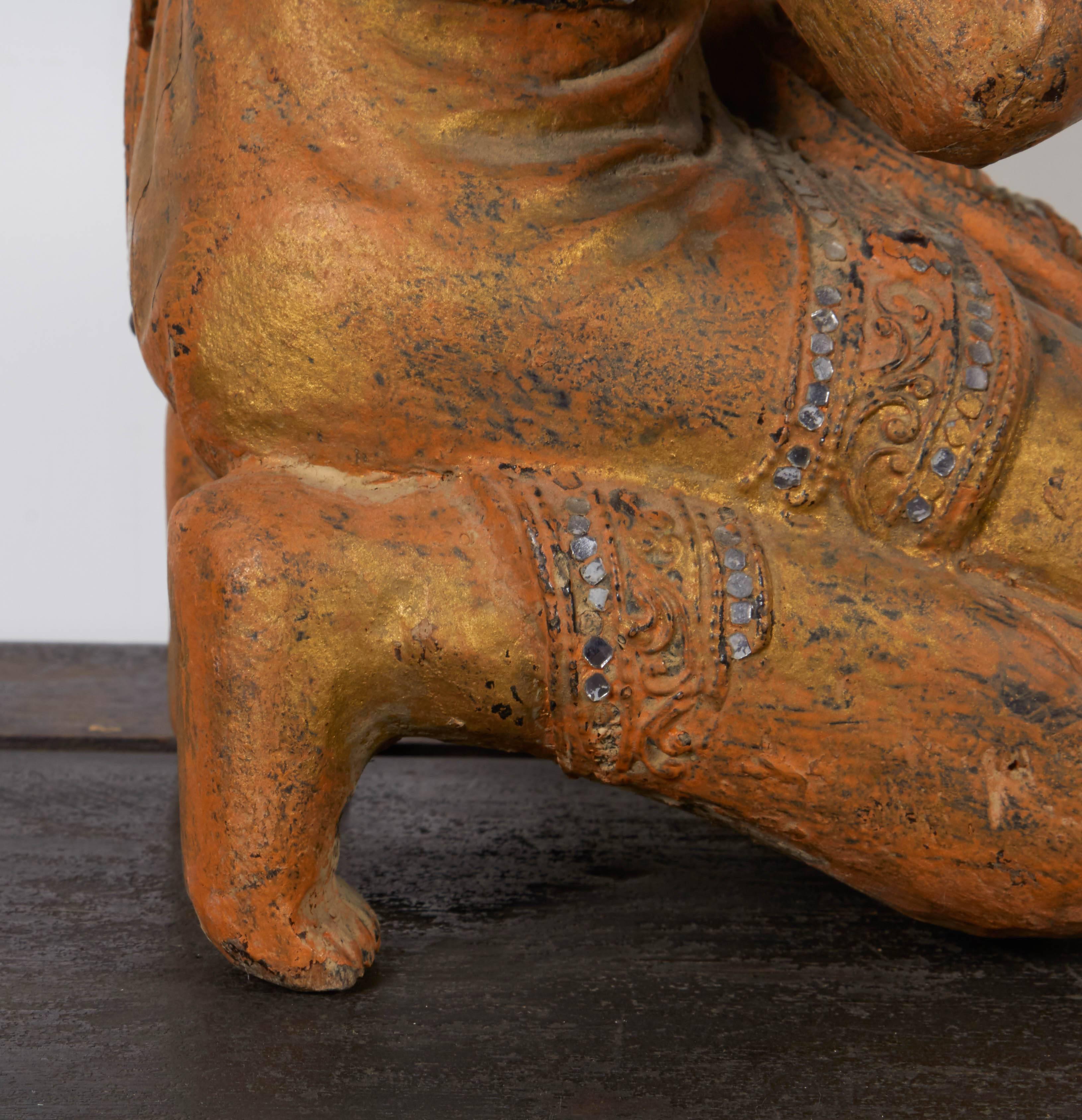 buddha statue with monk inside