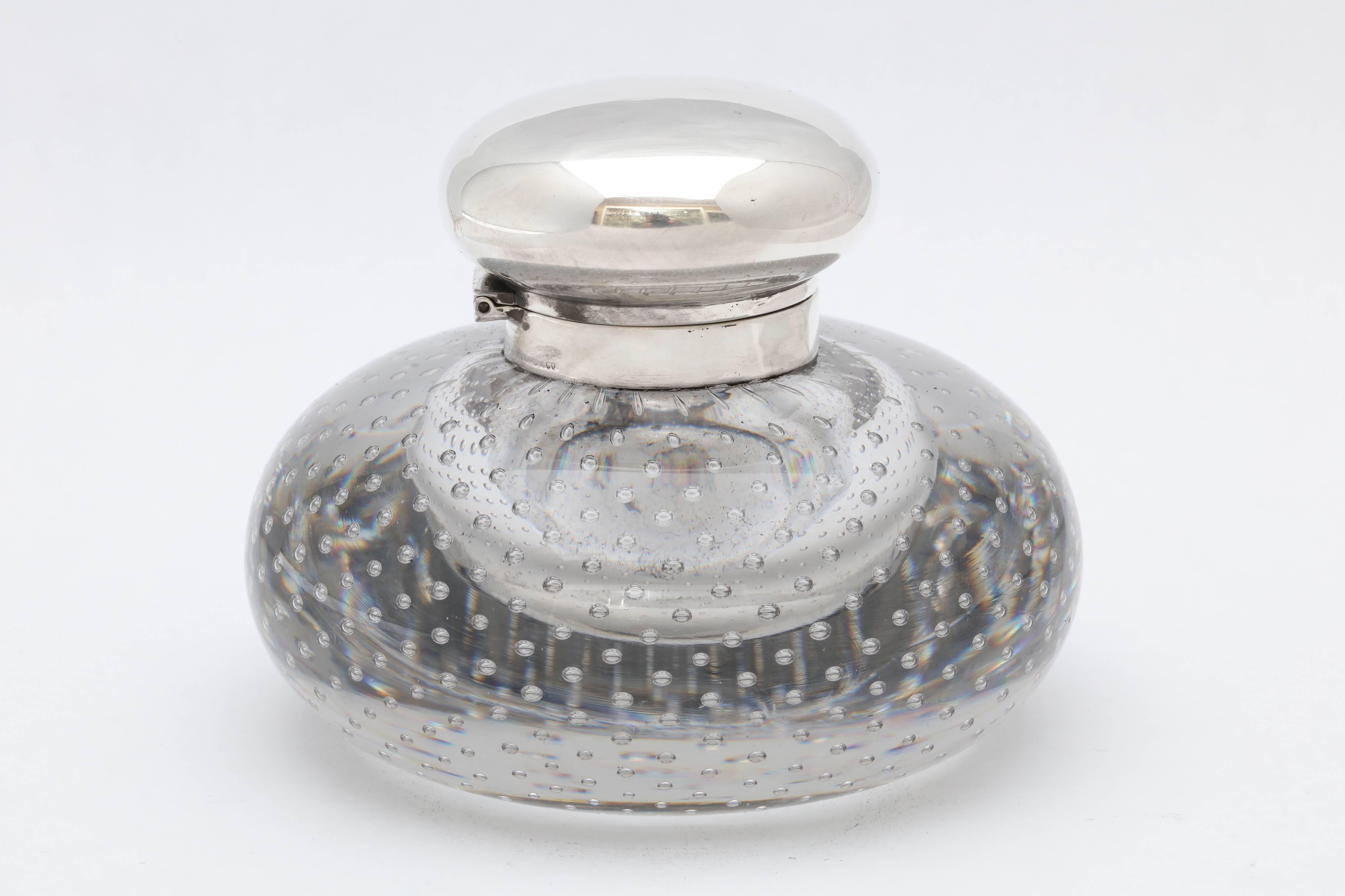 Large, Victorian period, sterling silver-mounted controlled bubbles crystal inkwell with hinged lid, Boston, circa 1895, Bigleow ,Kennard and Co. makers. Measures: 3 3/4 inches high x 4 1/4 inches diameter at widest point. Very heavy - weighs over 2