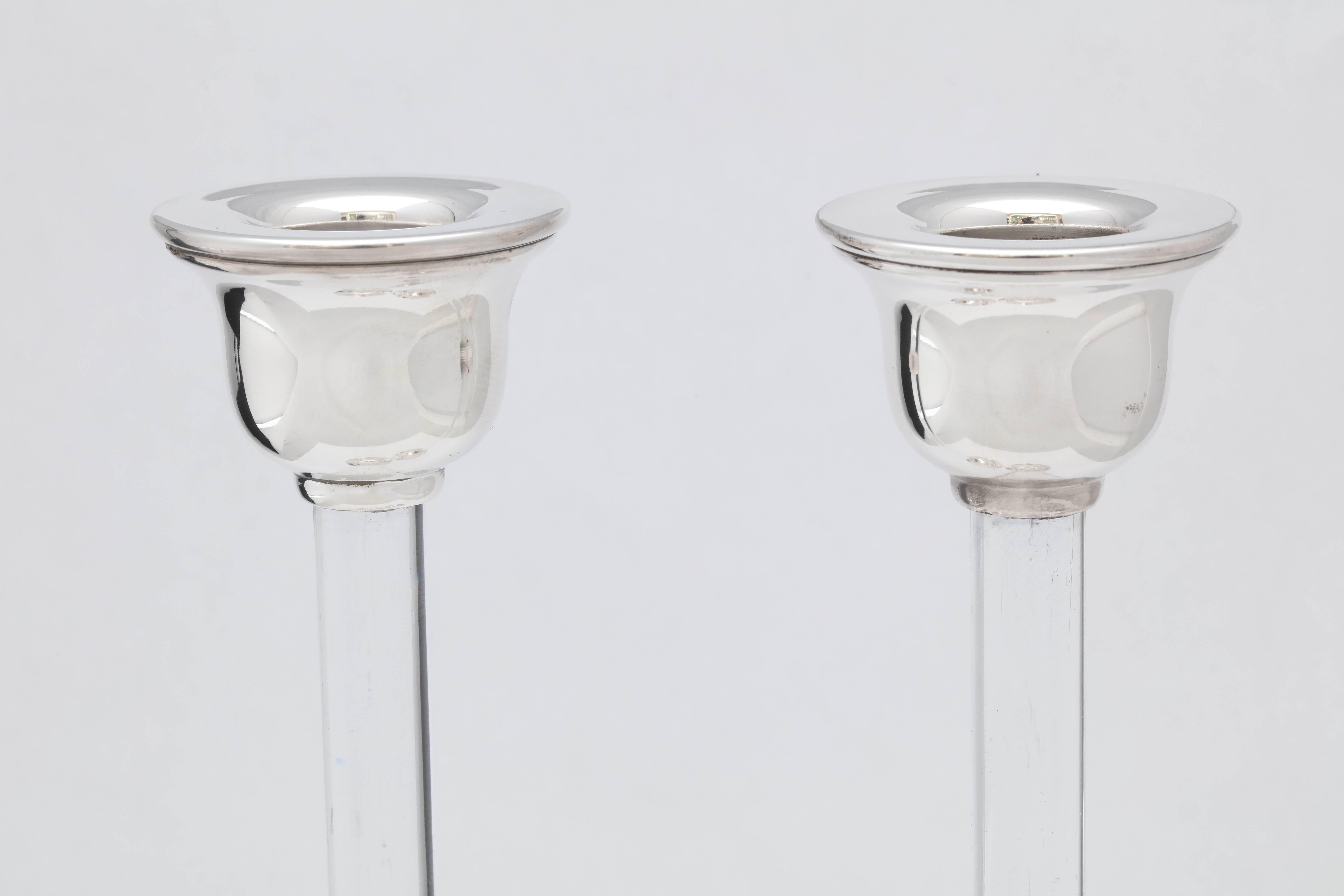 Pair of sterling Mid-Century Modern, sterling silver-mounted crystal candlesticks, European, circa 1950s-1960s. Each is 8 inches high x 2 1/2 inches diameter across base x 1 3/4 inches diameter across candle cup. Weighted. Lovely bell-shaped