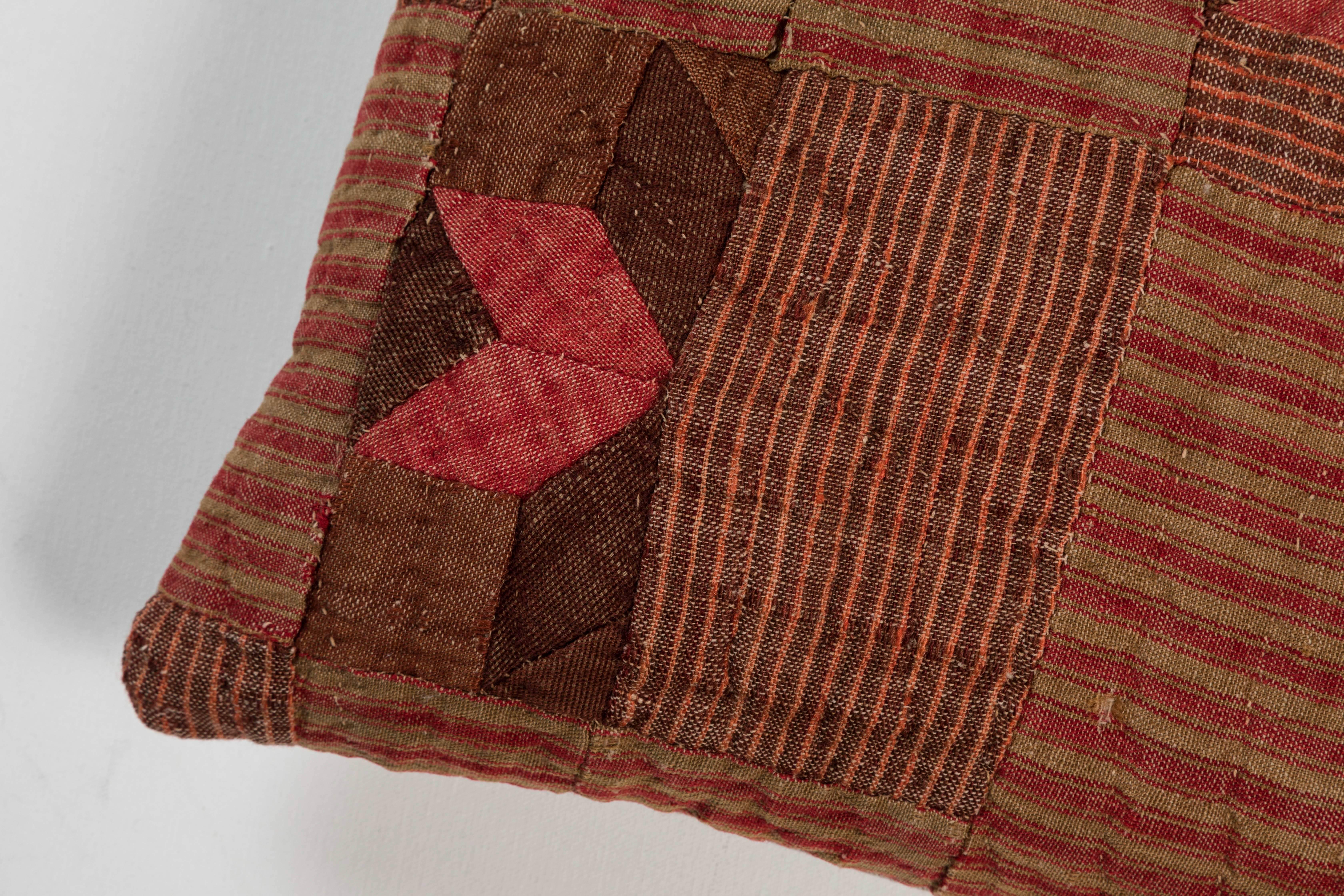 Patchwork of handwoven pieces of 19th century, French linen. Natural dye colors: rust red, olive green and brown. Natural color linen back, feather and down fill and invisible zipper.