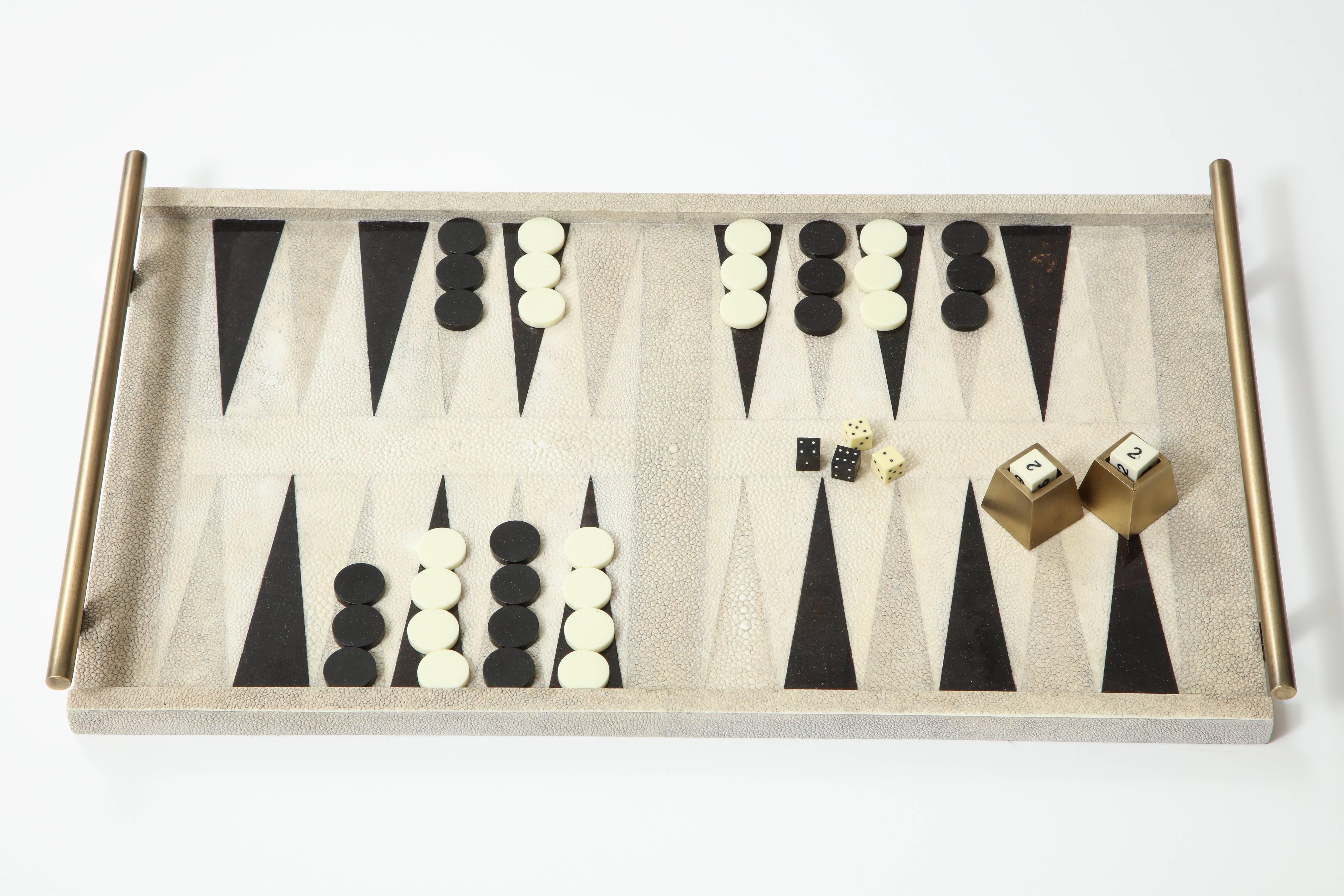 Decorative backgammon game designed in cream shagreen, black sea shell with bronze handles.