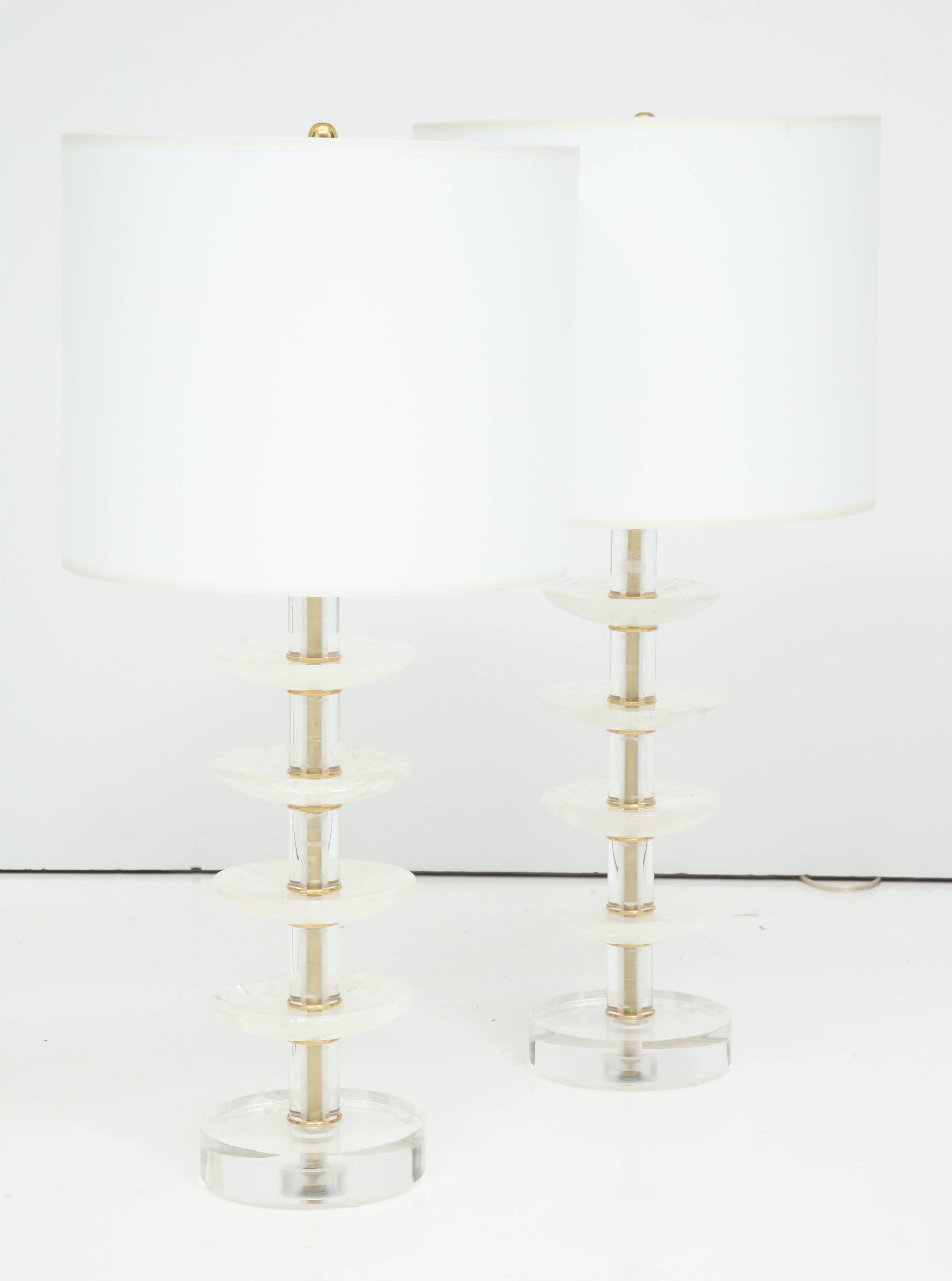 A unique and chic pair of lamps, made from rock crystal bobeches from a 19th century chandelier on a Lucite base.