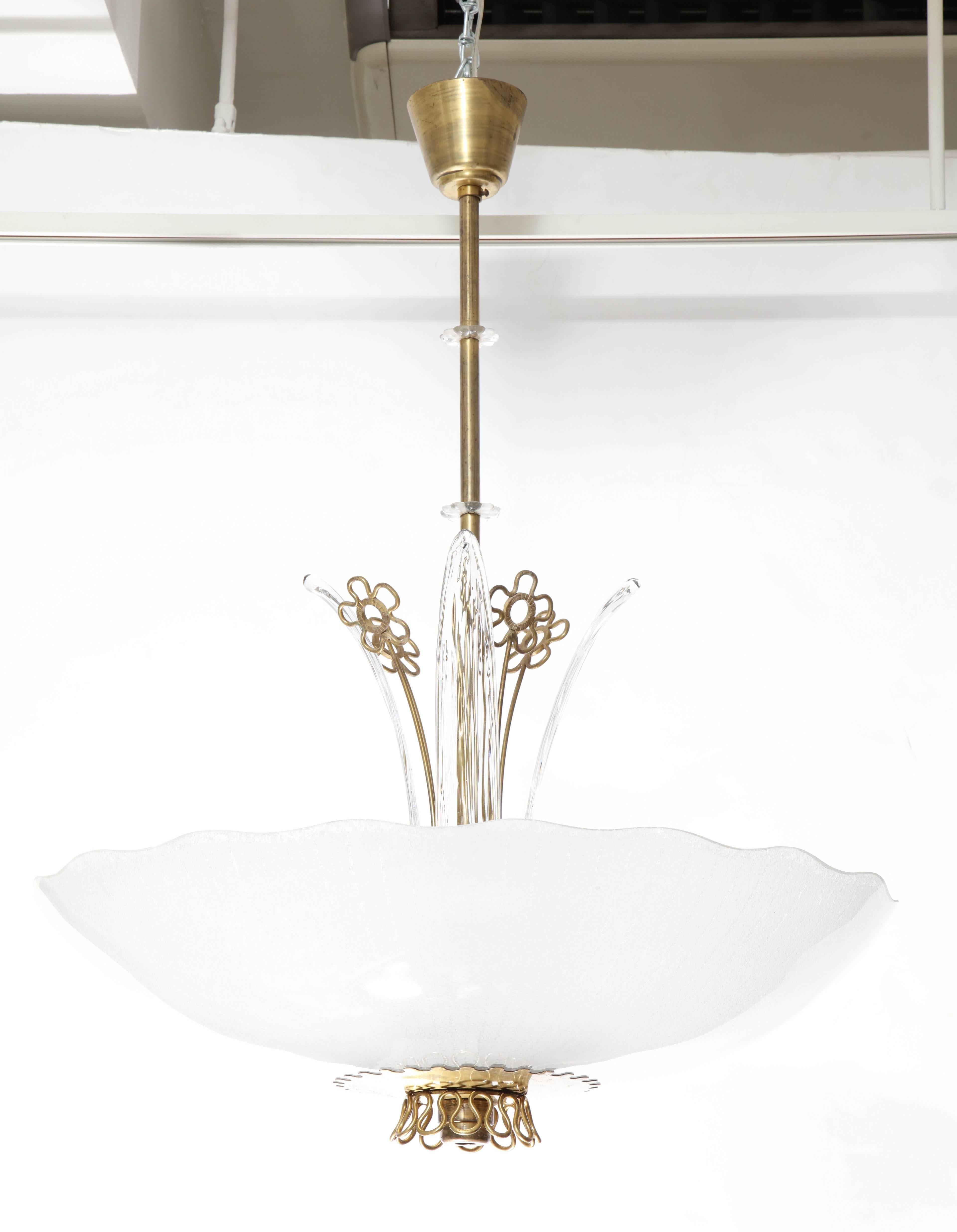 A pair of Orrefors chandeliers with brass frame with lily -shapes. Large bowl-shaped frosted glass shade, eight sockets and four glass 